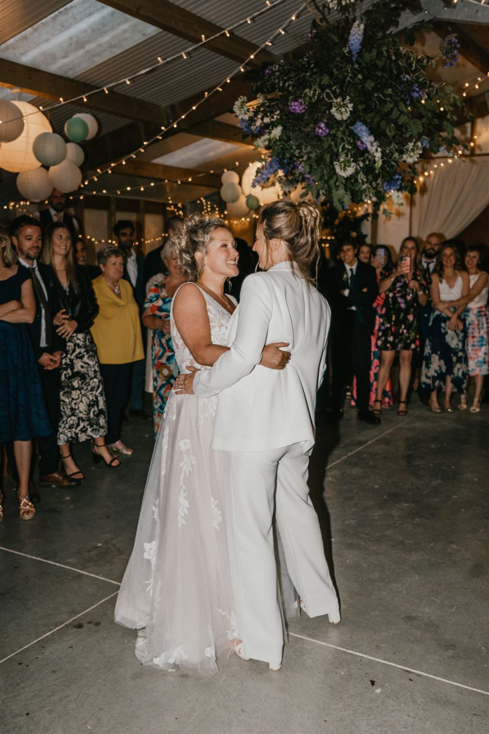 two brides having their first dance at diy wedding venue acorn barn in oxfordshire
