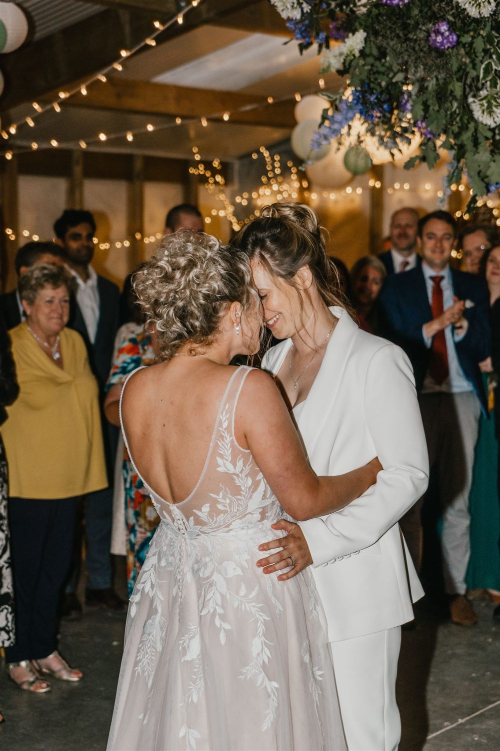 two brides having their first dance at diy wedding venue acorn barn in oxfordshire