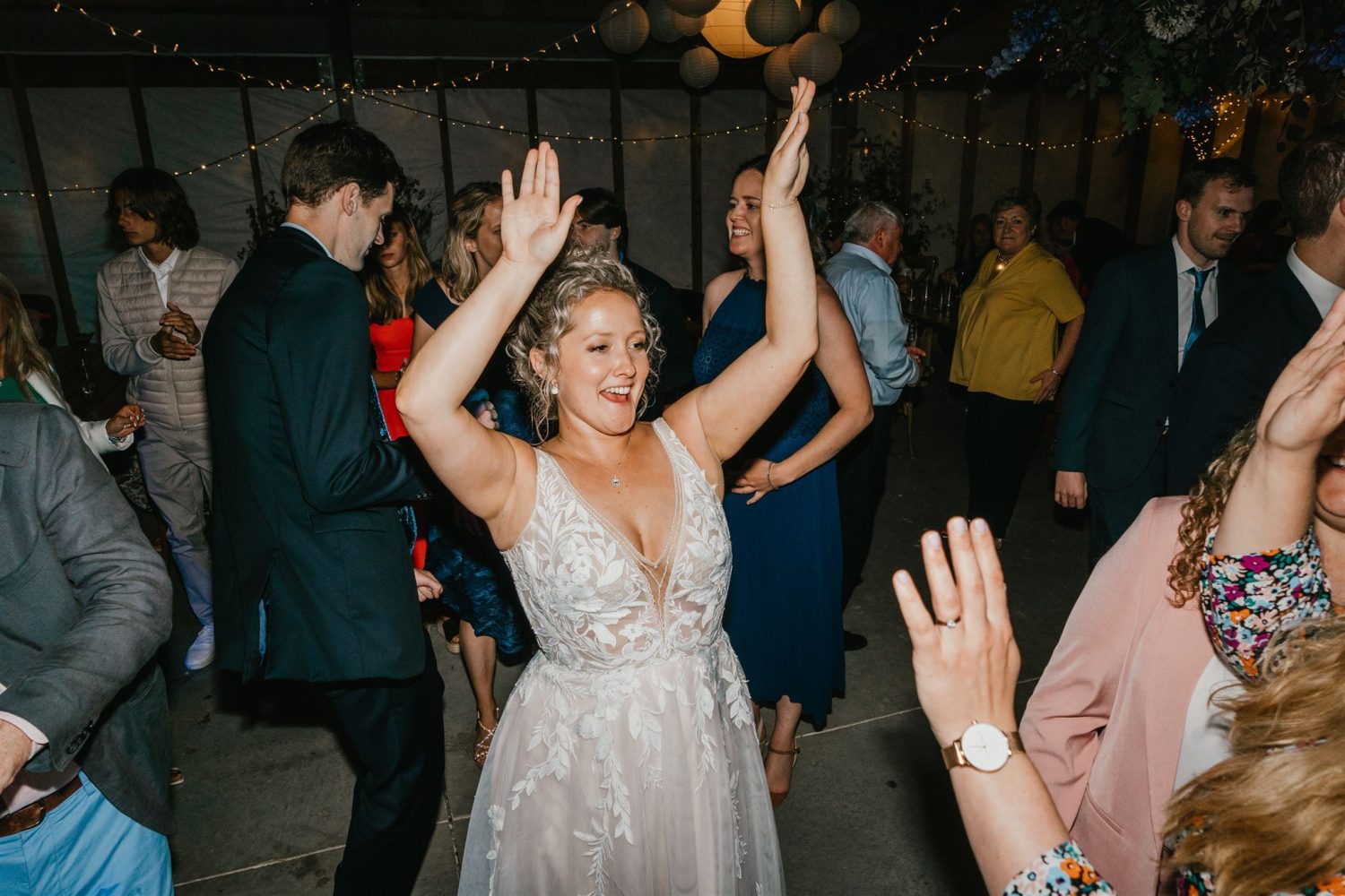 bride partying on the dance floor at diy wedding in oxfordshire