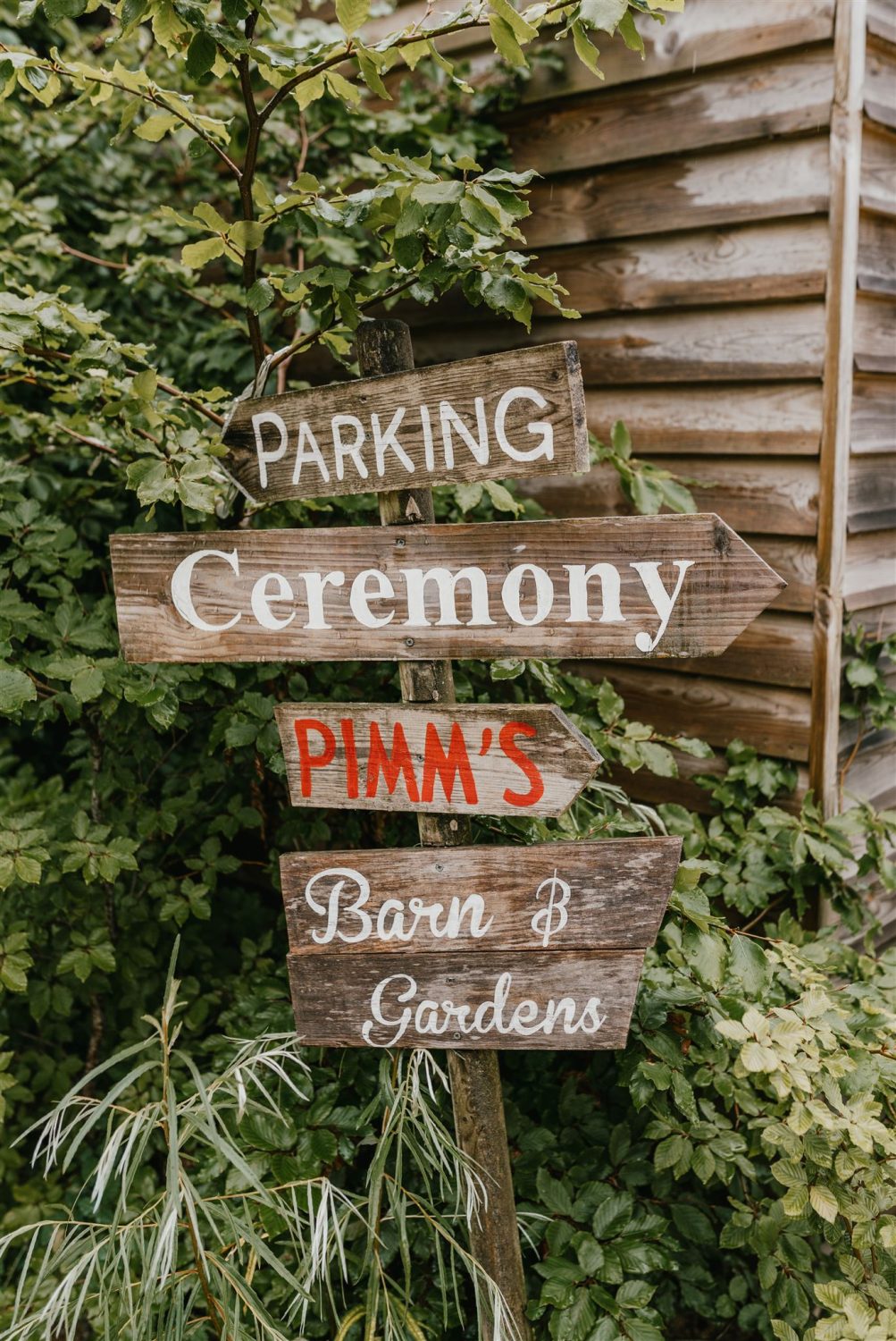 wooden signs at acorn barn wedding venue in oxfordshire