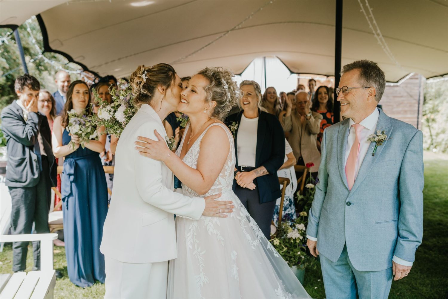 brides greet each other at acorn barn wedding ceremony