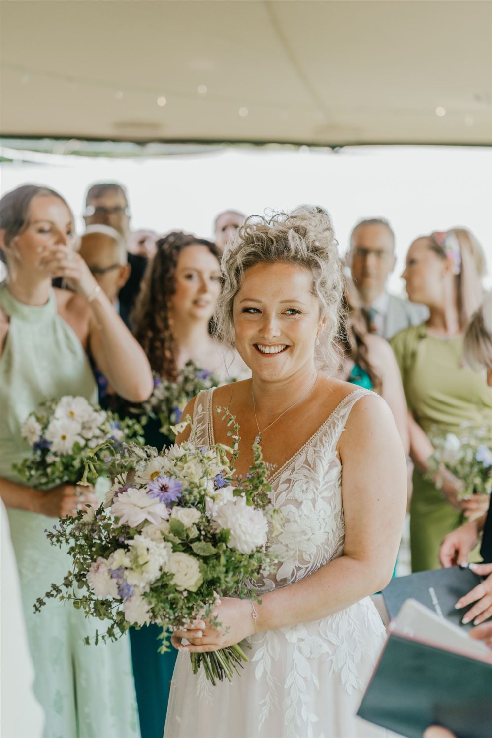 bride during outdoor wedding ceremony at acorn barn wedding venue in oxfordshire