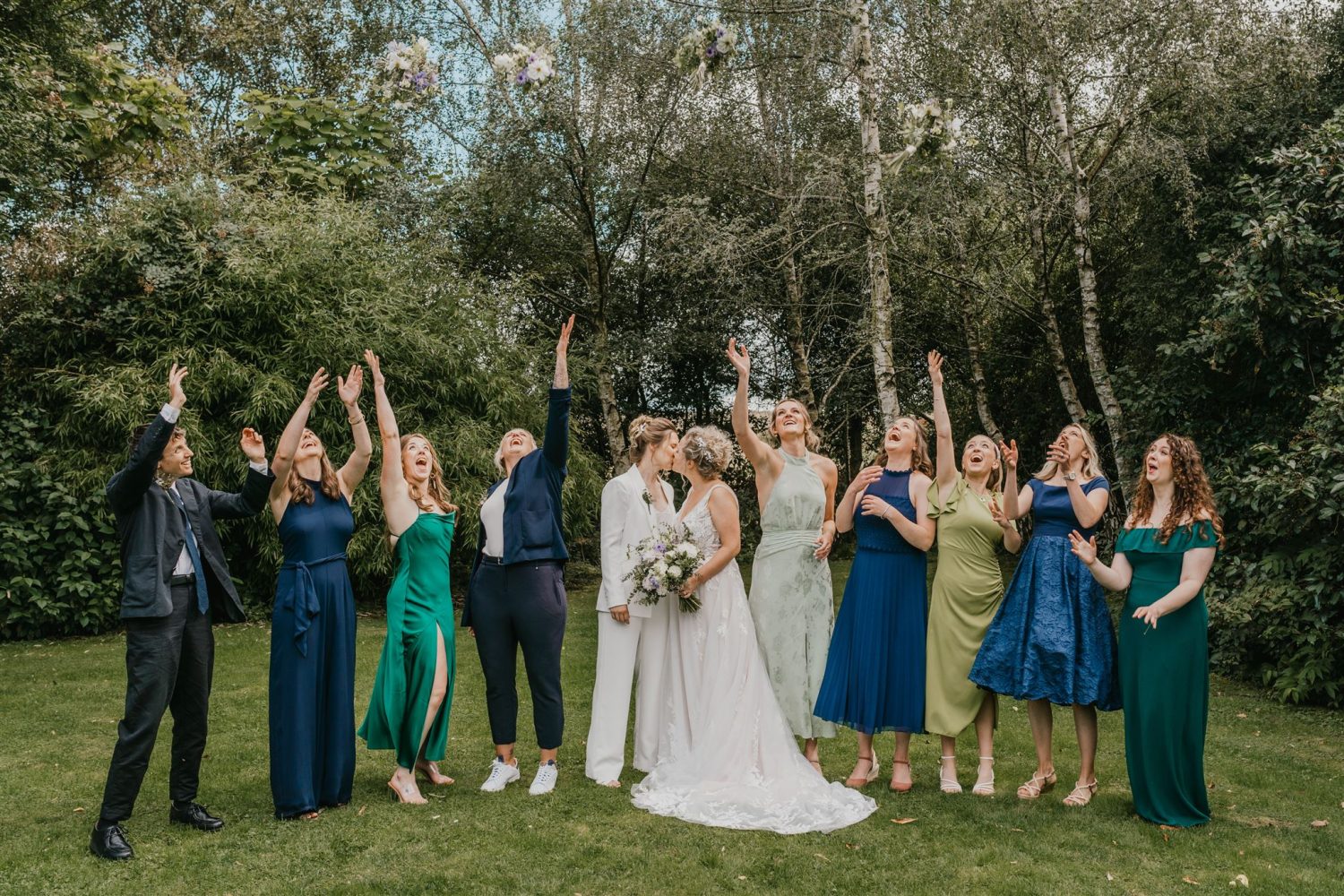 bridal party bouquet toss at acorn barn wedding venue in oxfordshire