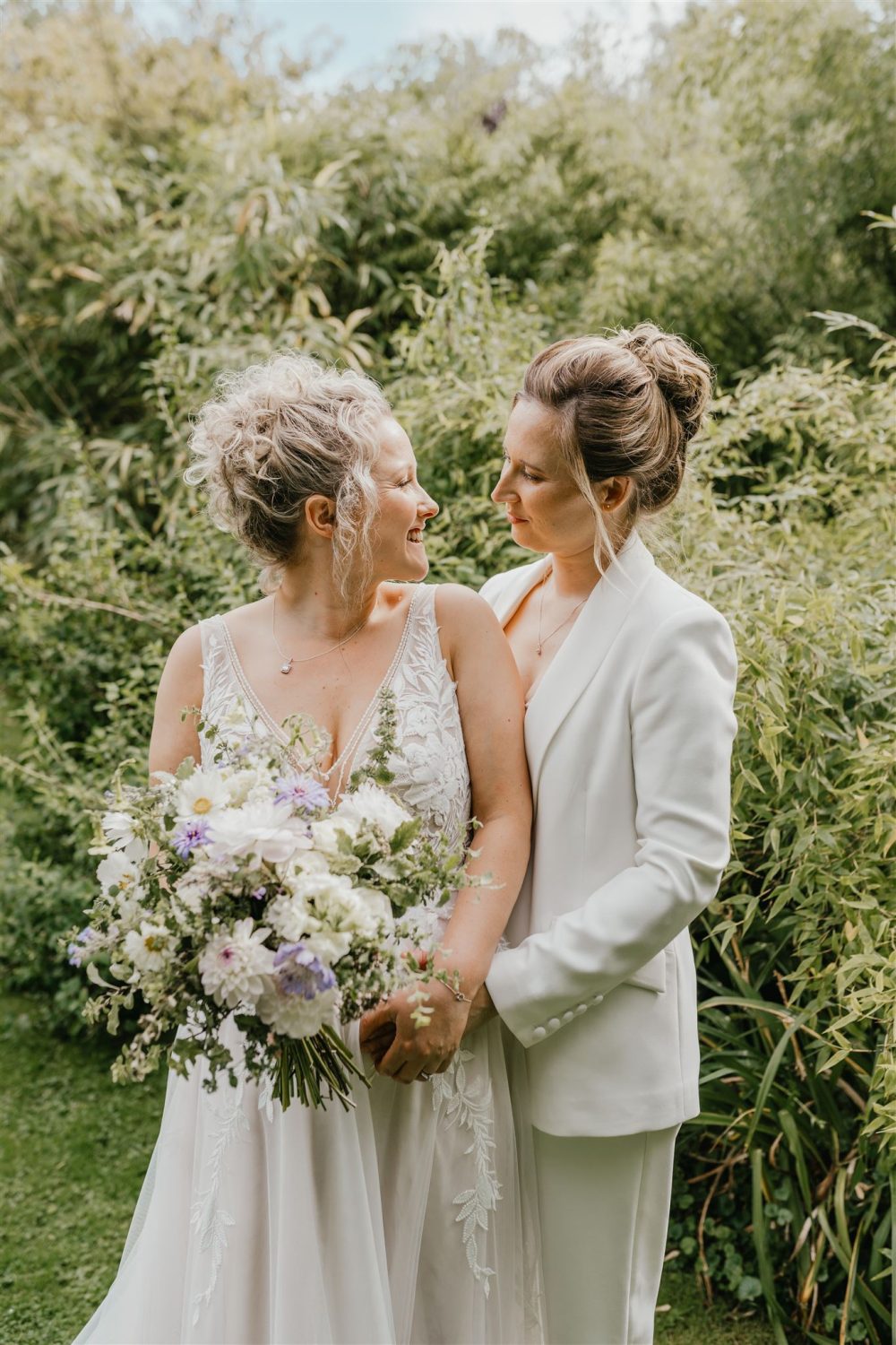 couple portraits in gardens at acorn barn wedding venue in oxfordshire