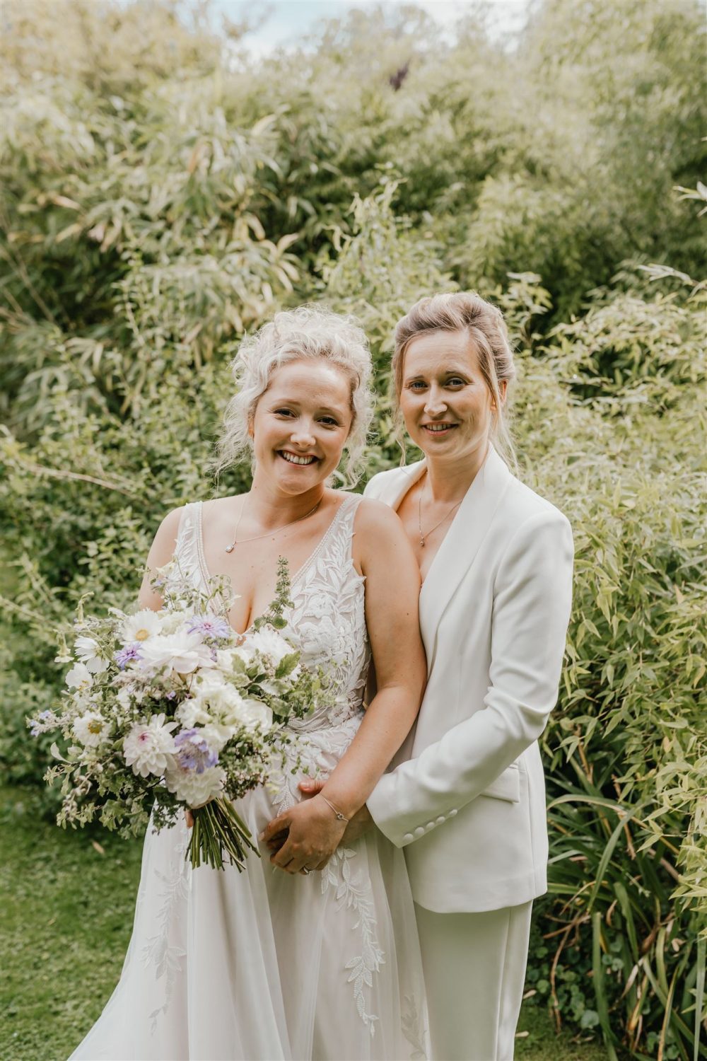 couple portraits in gardens at acorn barn wedding venue in oxfordshire