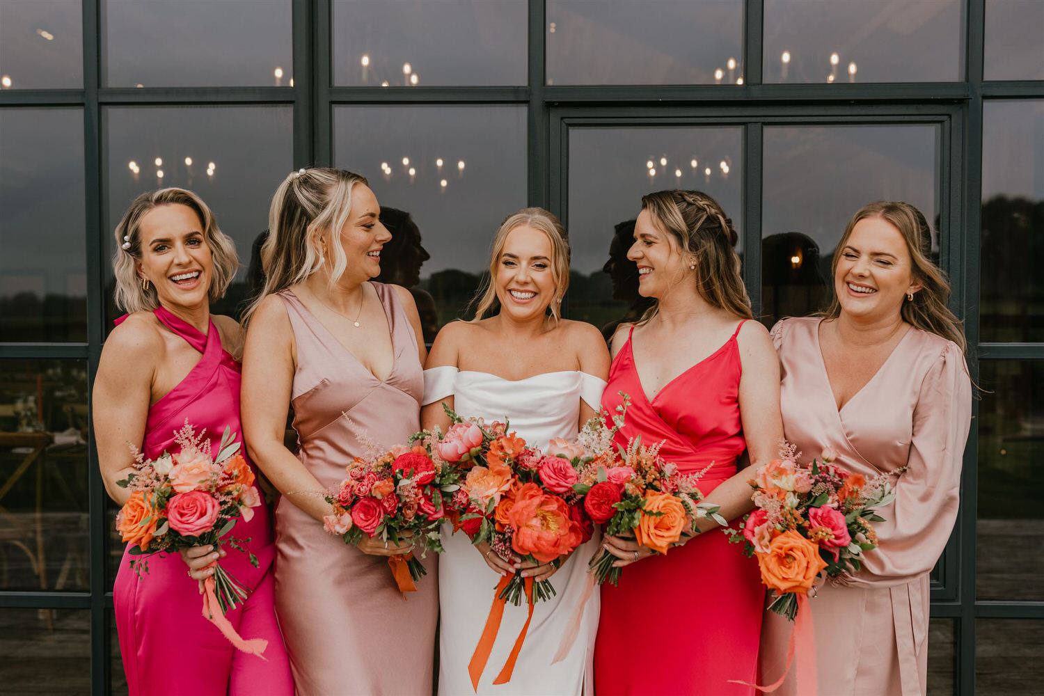 bride and bridesmaids outside botley hill barn