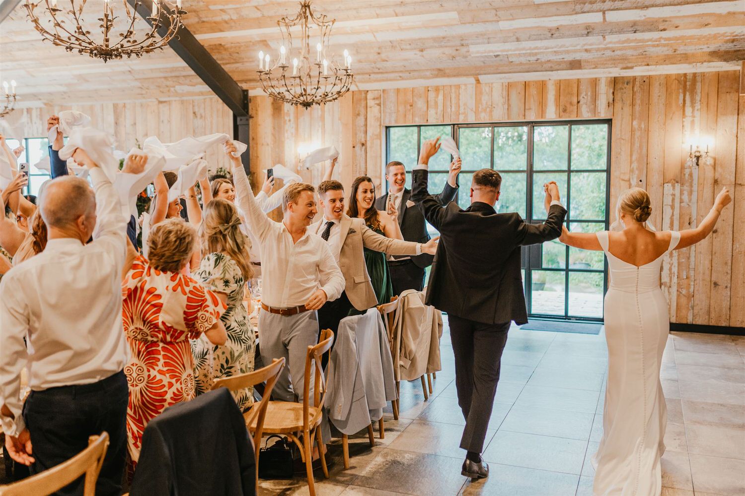bride and groom entrance to the barn at botley hill wedding