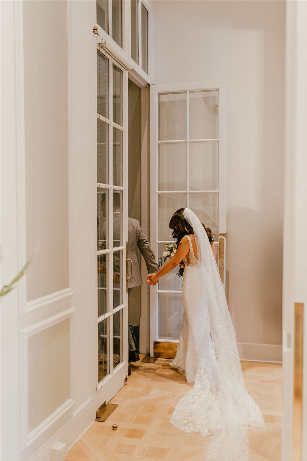 bride and groom leave wedding ceremony in the loggia at mandarin oriental hyde park luxury wedding venue in london