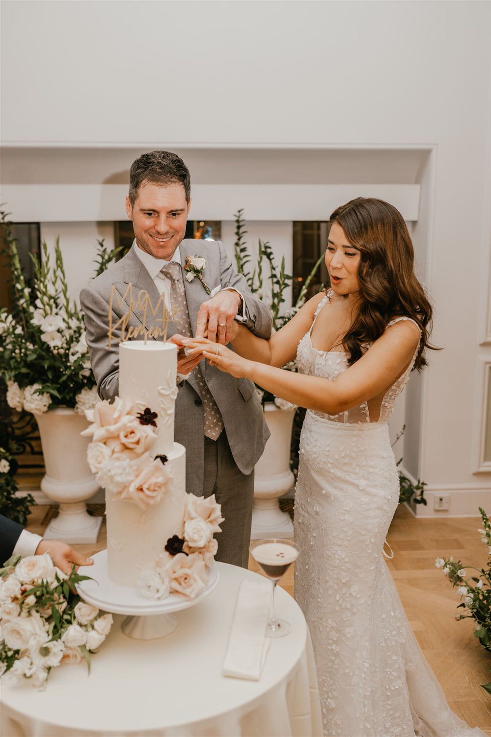 bride and groom cut wedding cake at mandarin oriental wedding london