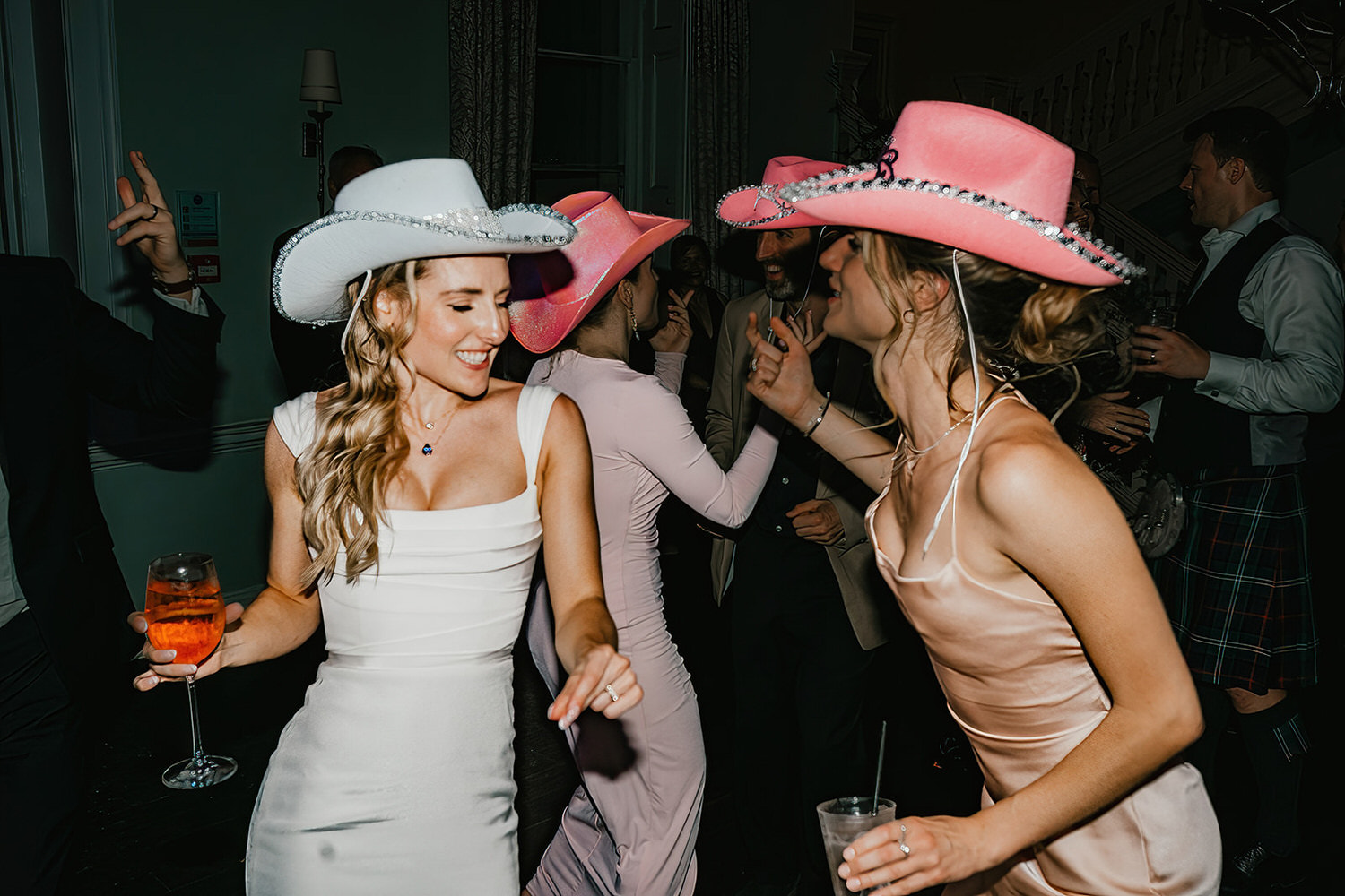 bride and bridesmaid on the dance floor at morden hall wedding in london