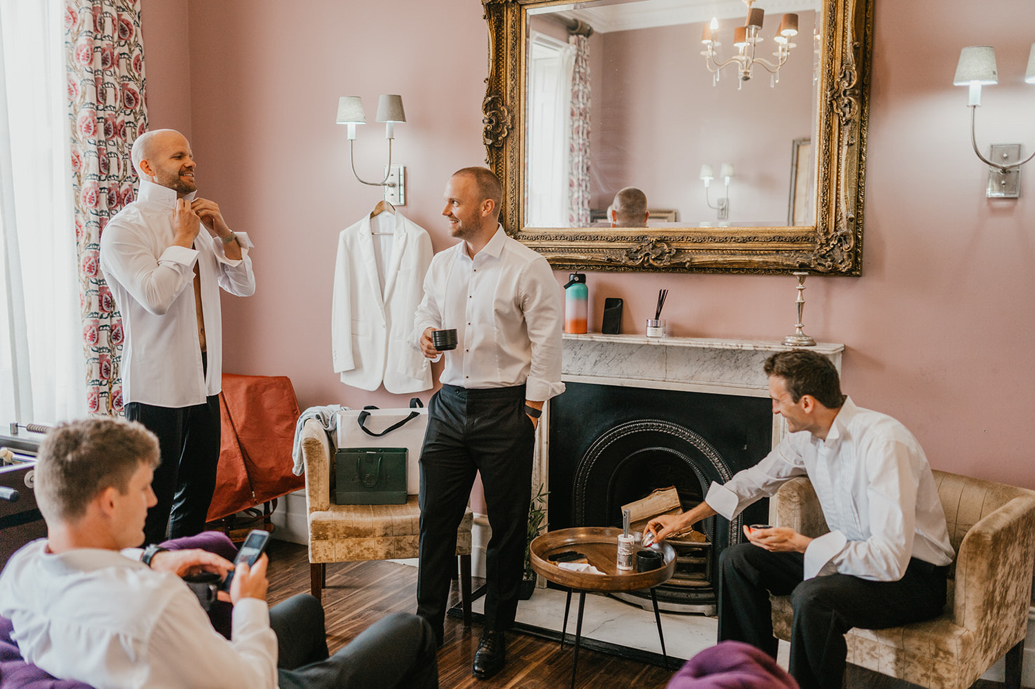 groom and groomsmen getting ready at morden hall wedding groom prep