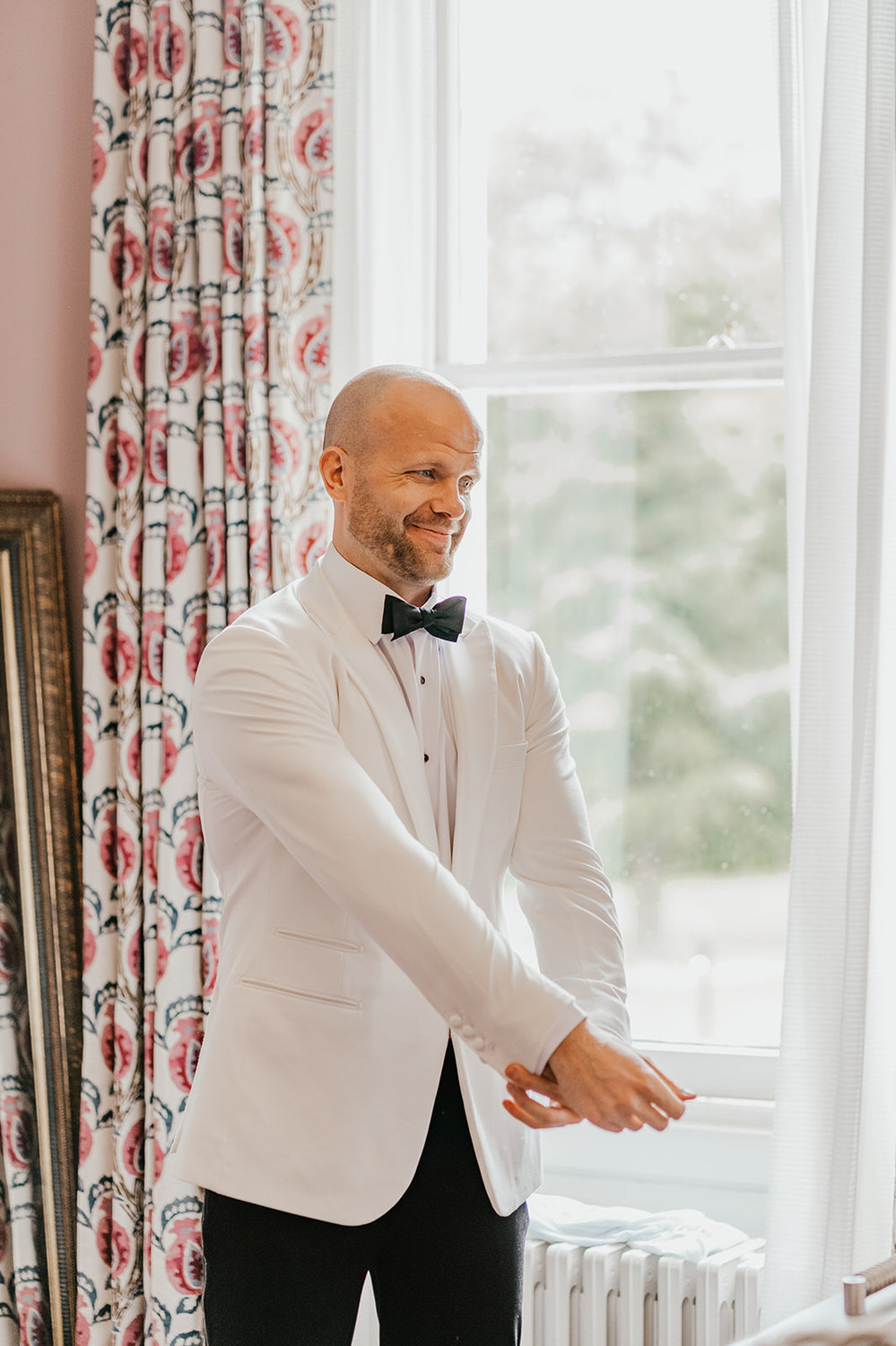 groom getting ready at morden hall wedding groom prep