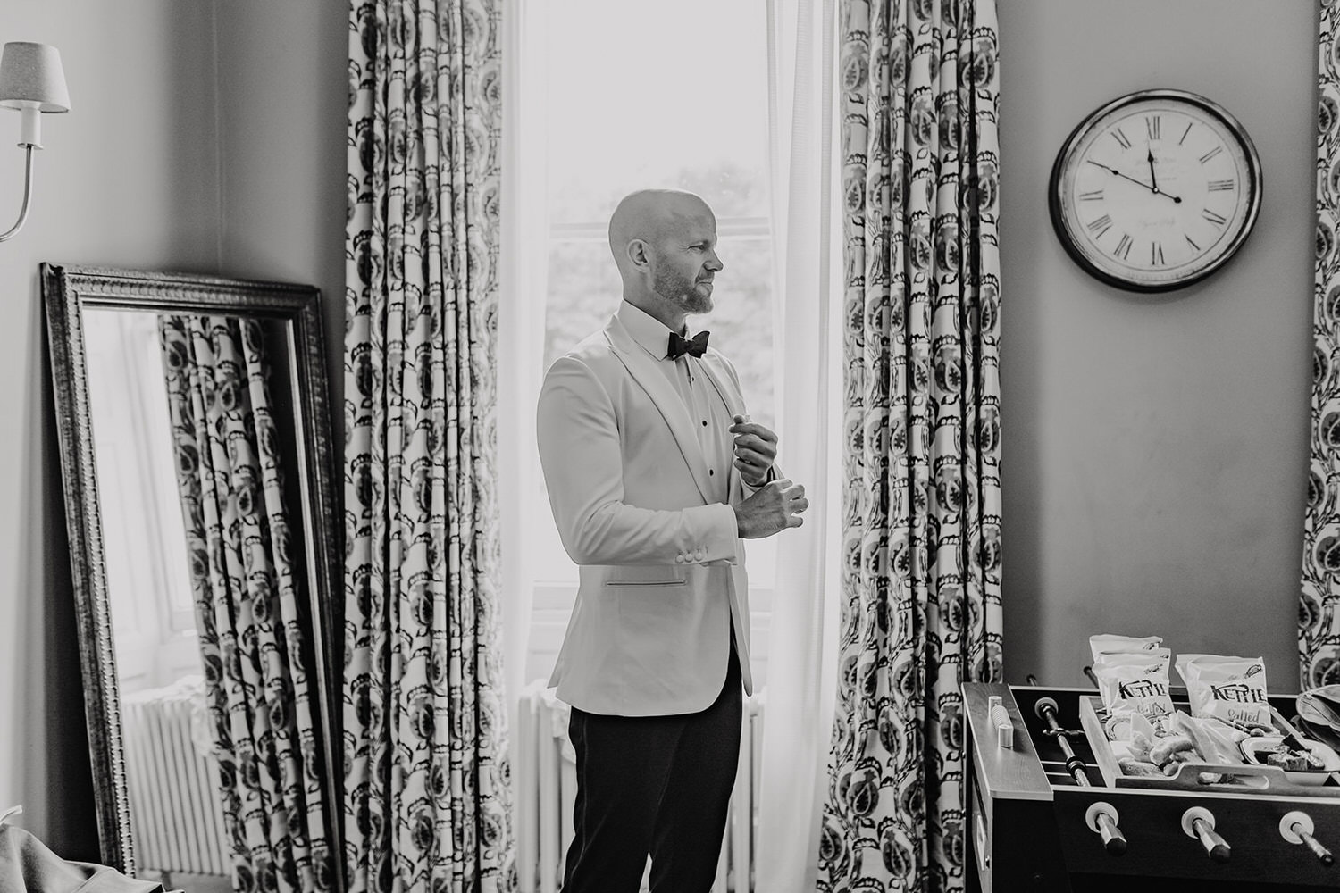 black and white photo of groom at morden hall wedding groom prep