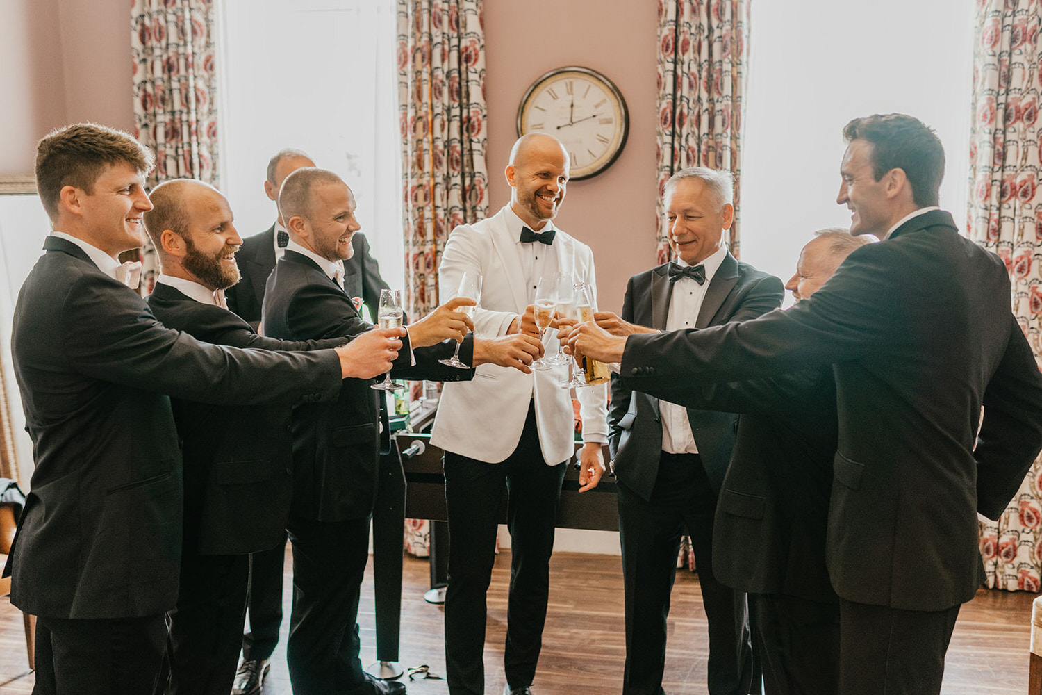 groom and groomsmen get ready at morden hall wedding groom prep