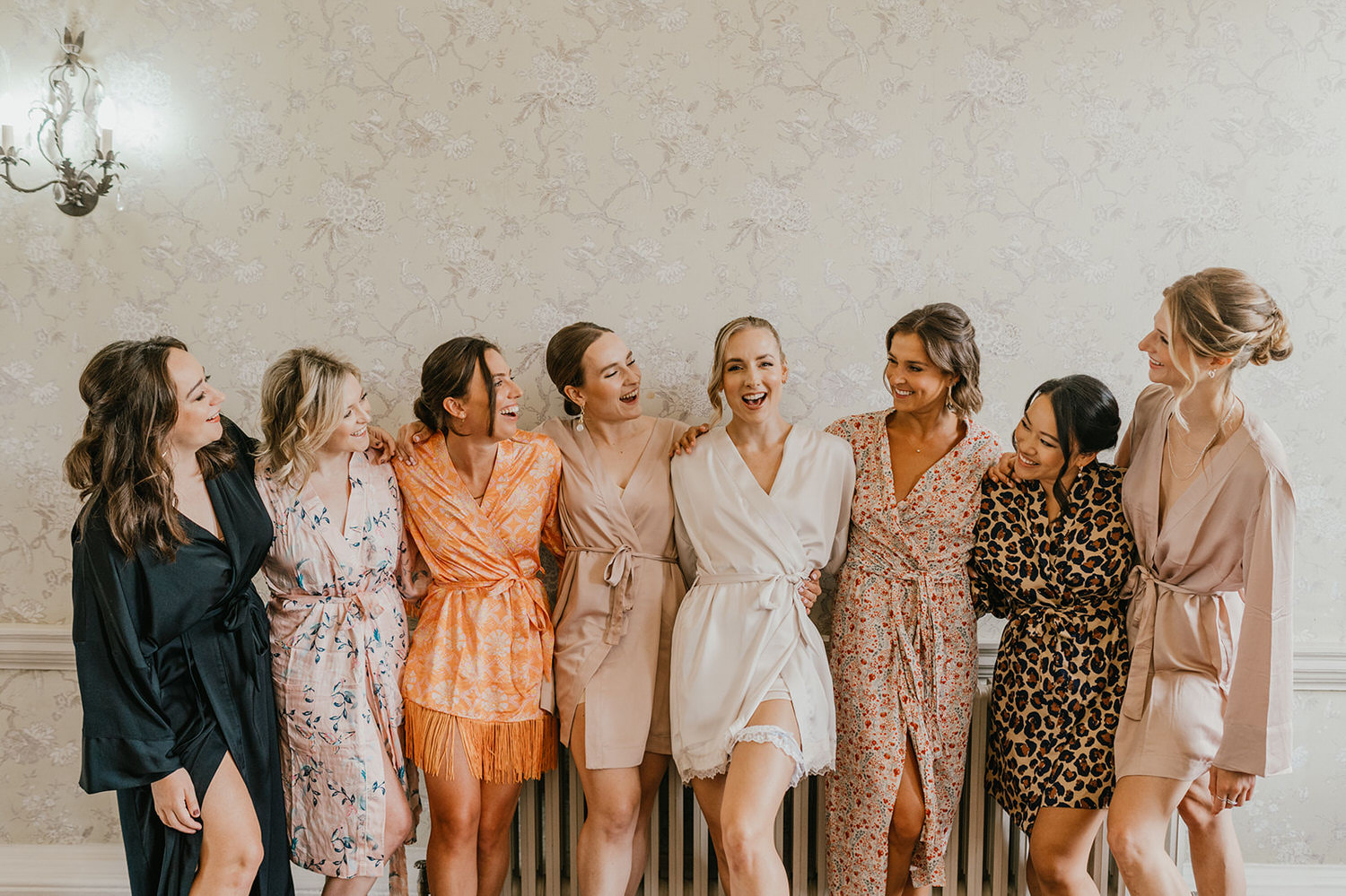 bride and bridesmaids in robes at morden hall wedding bridal prep