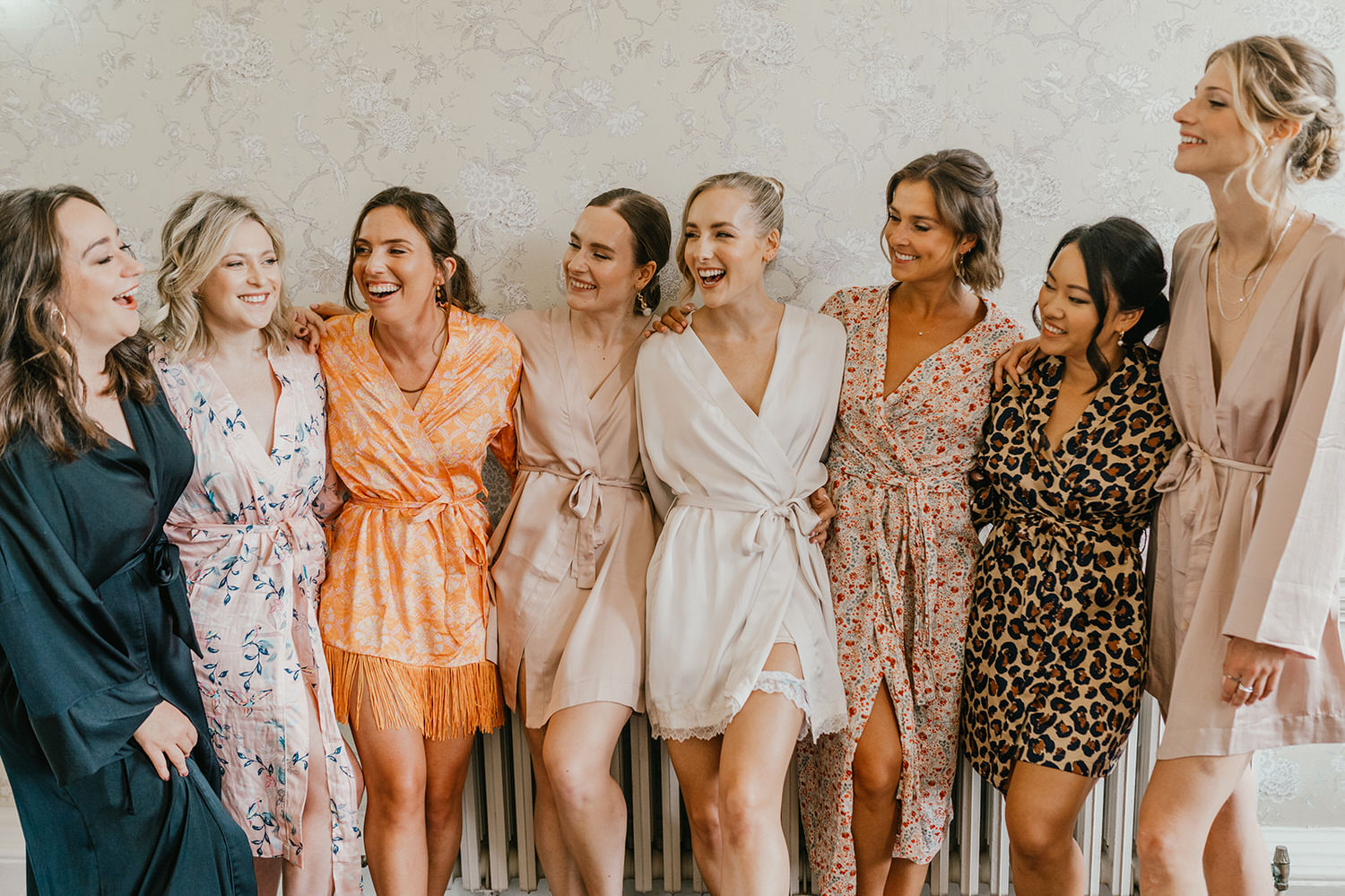 bride and bridesmaids in robes at morden hall wedding bridal prep