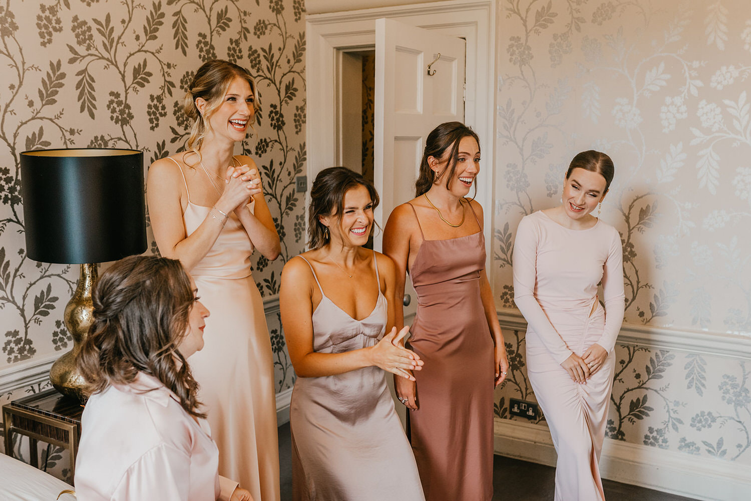 bride's dress reveal to bridesmaids at morden hall wedding