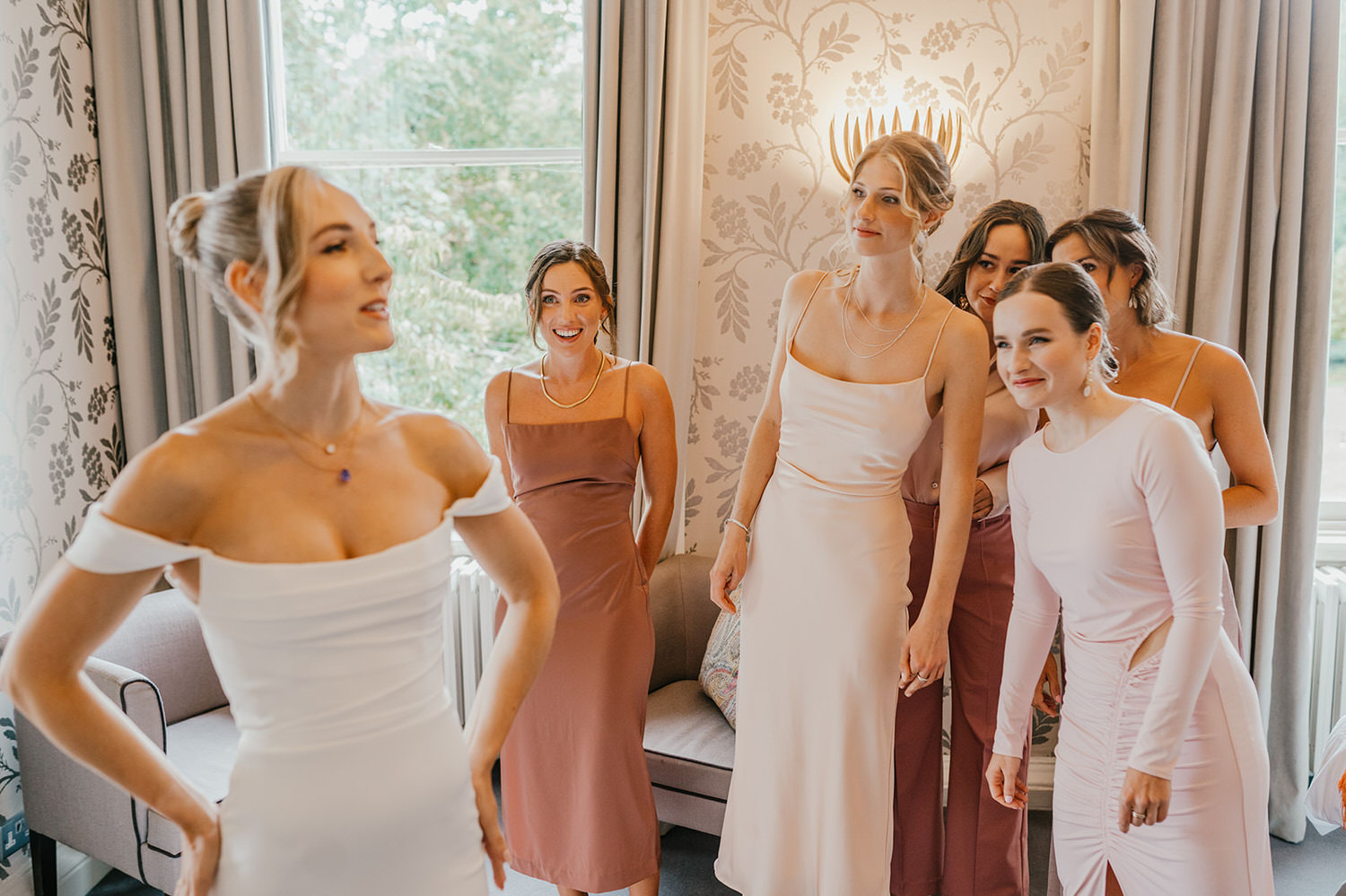 bride's dress reveal to bridesmaids at morden hall wedding