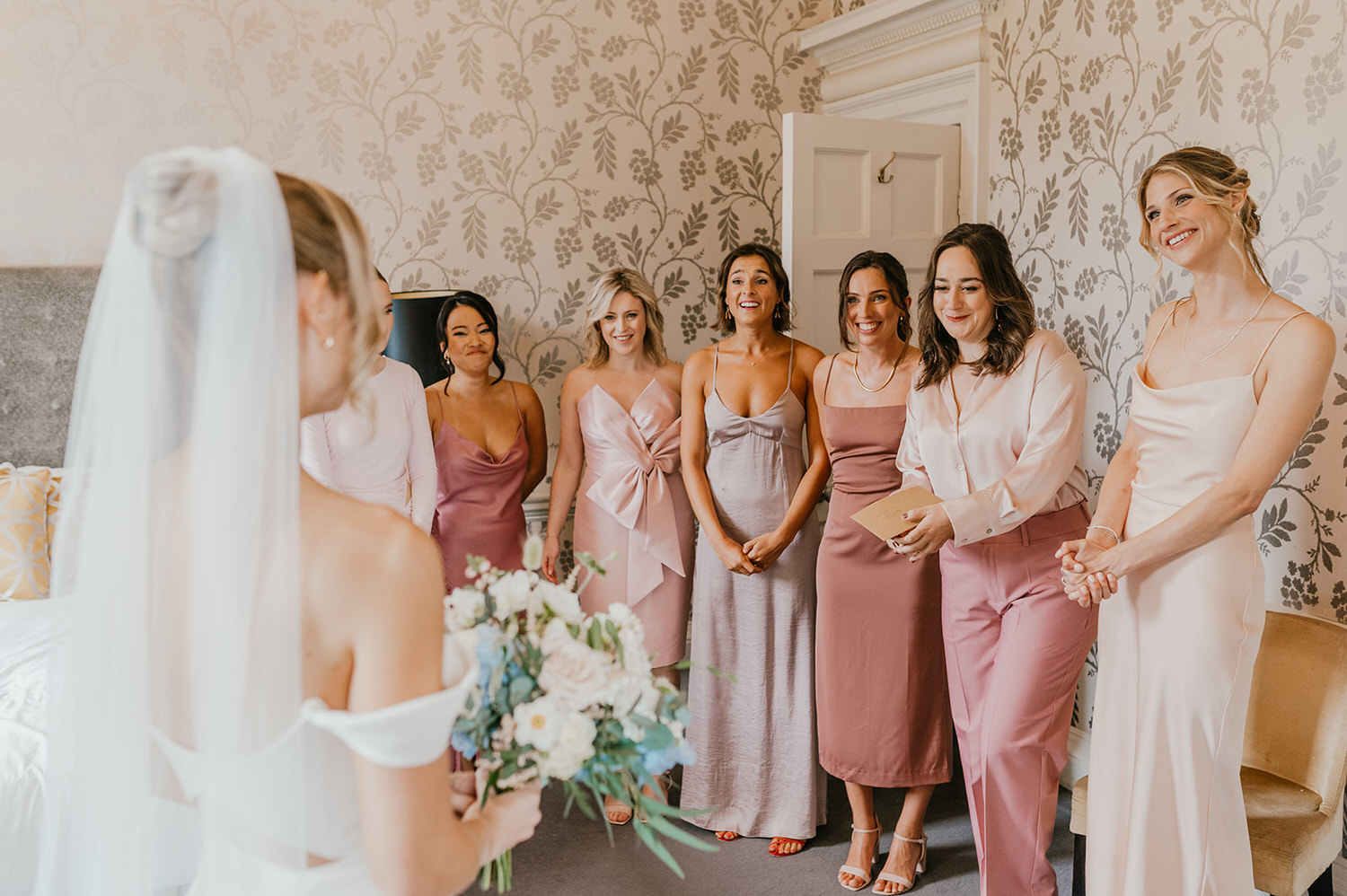 bride's dress reveal to bridesmaids at morden hall wedding