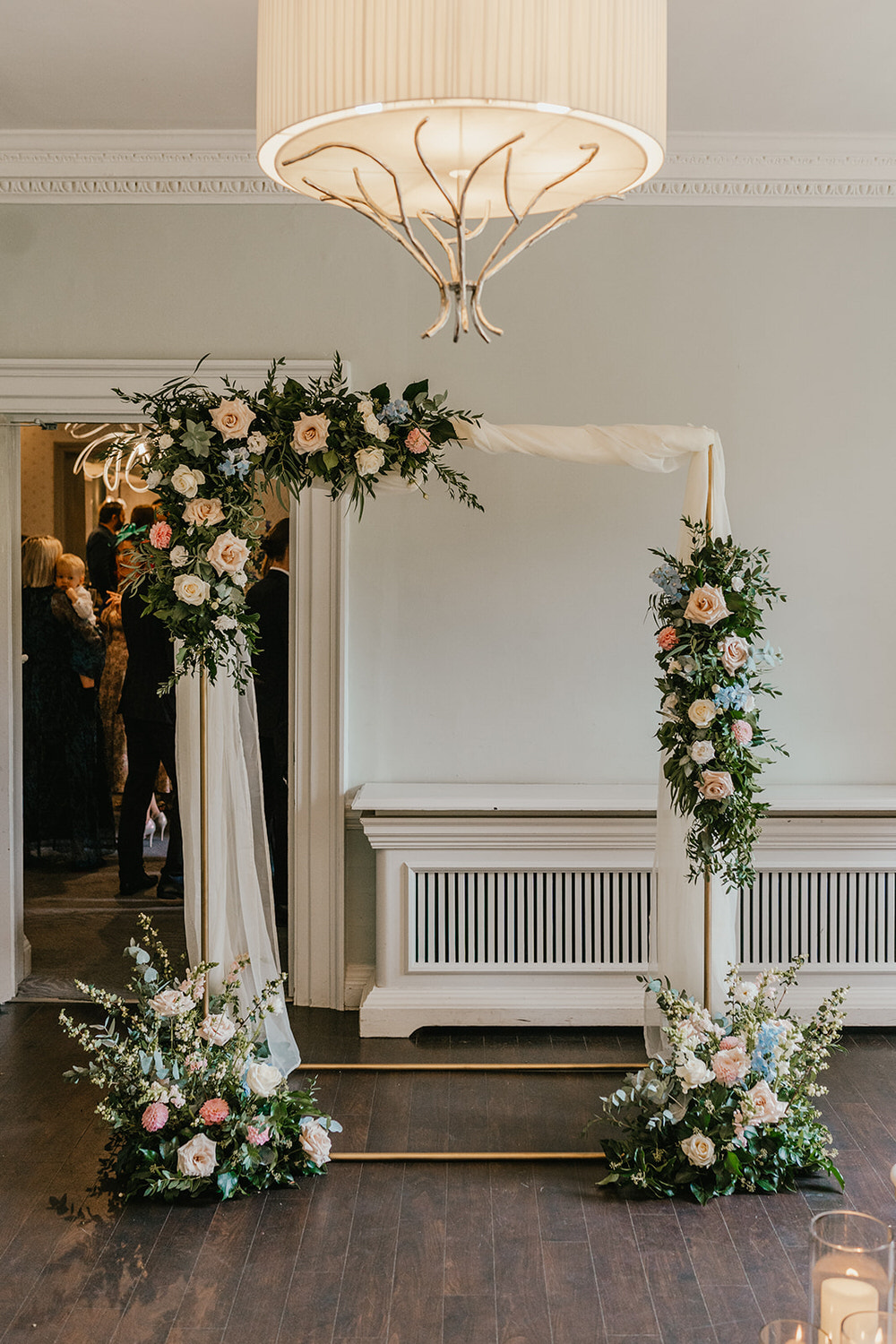 flower arch in morden hall wedding ceremony room