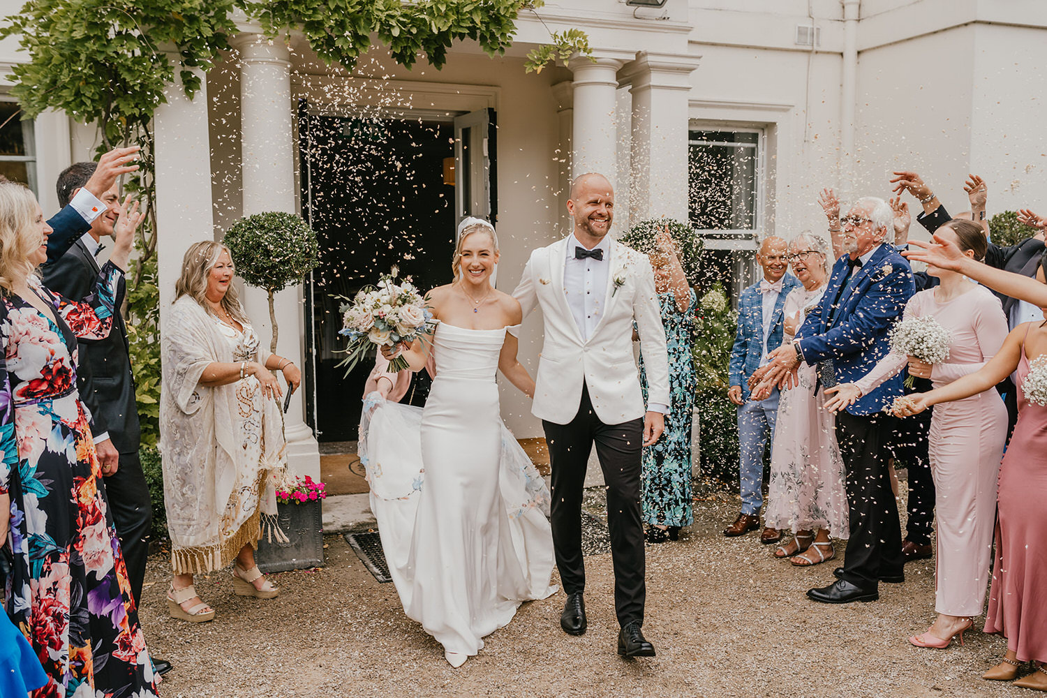 bride and groom confetti walk at morden hall wedding venue in london