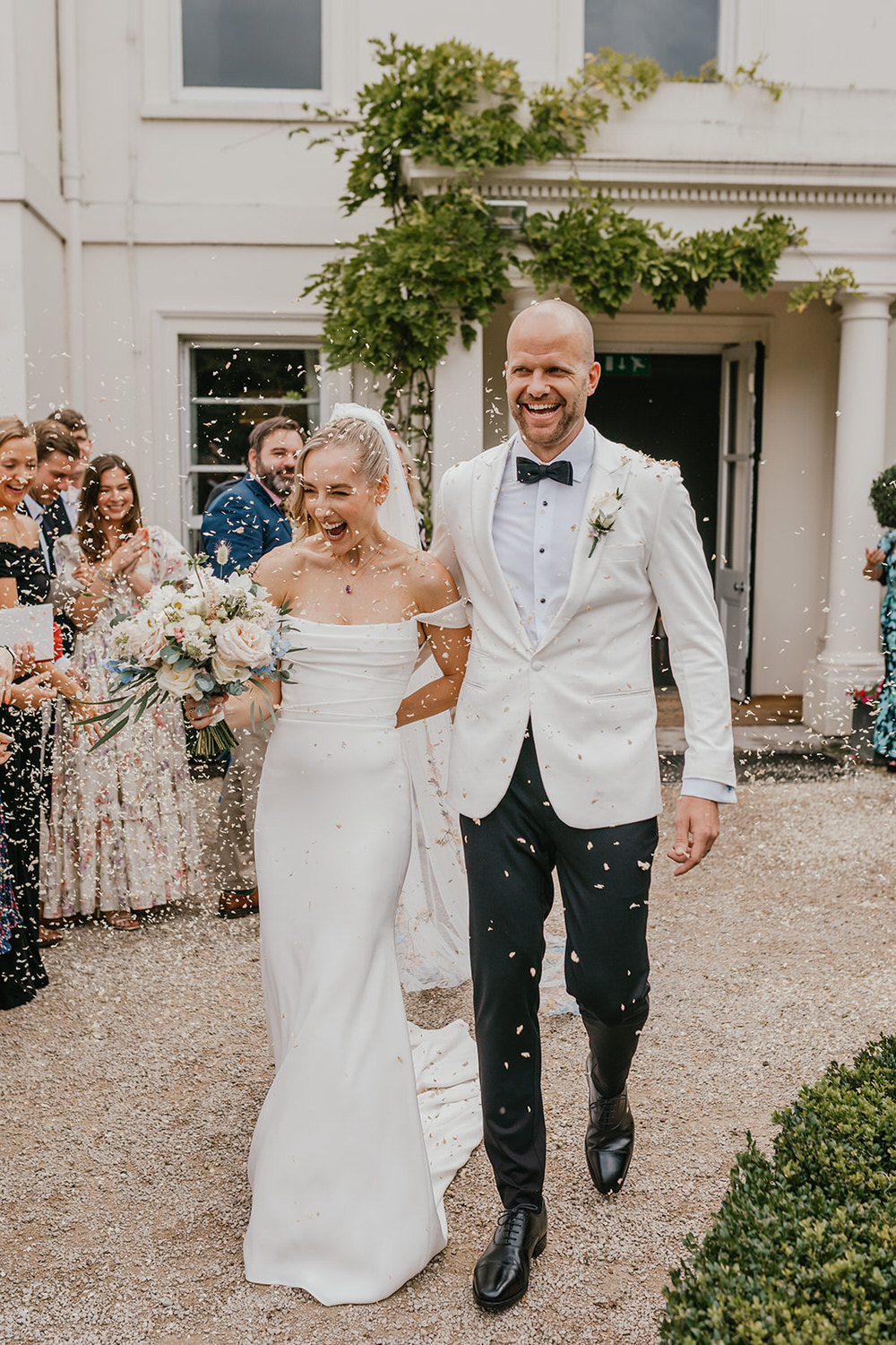 bride and groom confetti walk at morden hall wedding venue in london