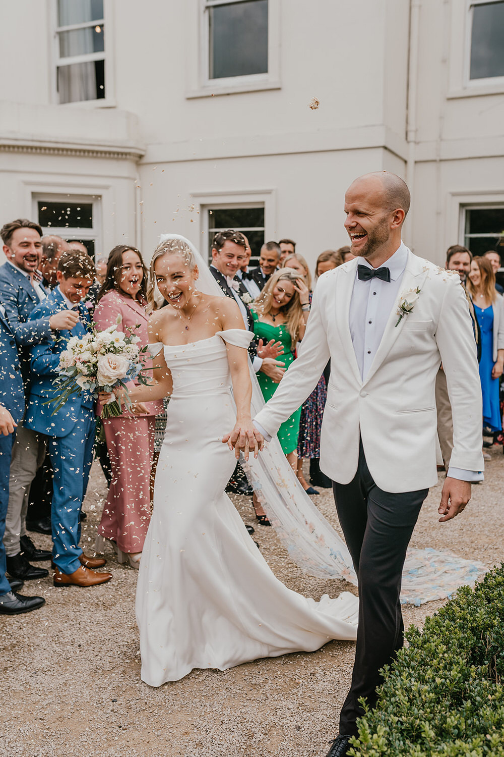 bride and groom confetti walk at morden hall wedding venue in london