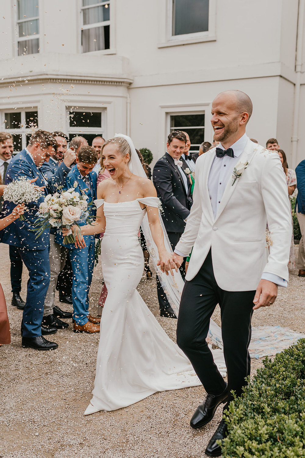 bride and groom confetti walk at morden hall wedding venue in london