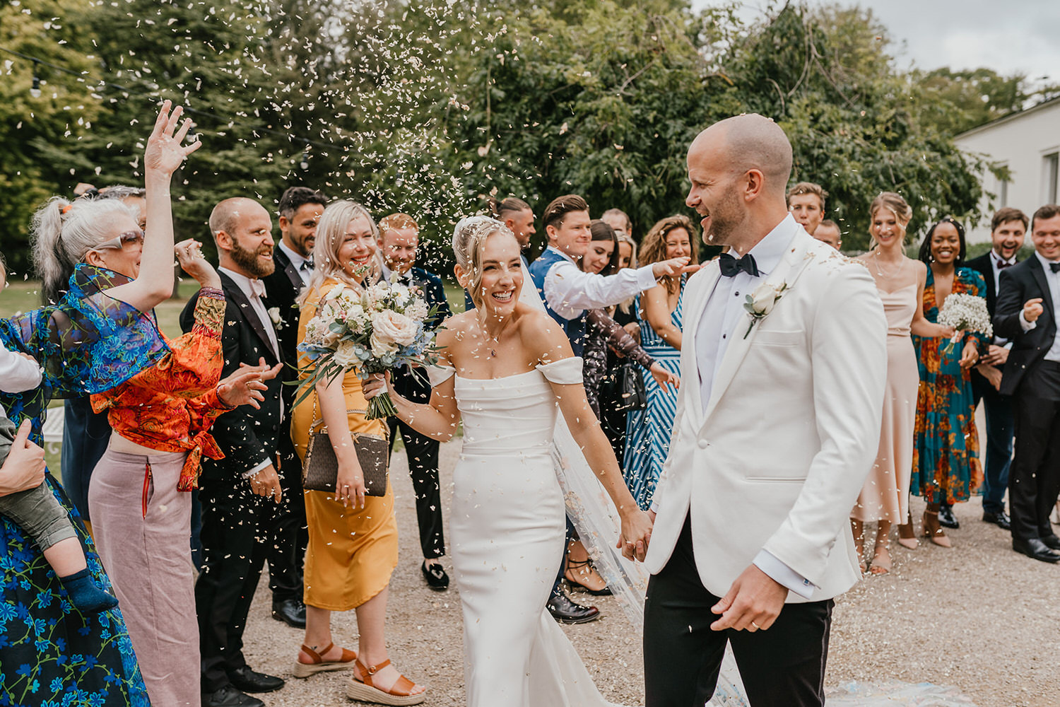 bride and groom confetti walk at morden hall wedding venue in london