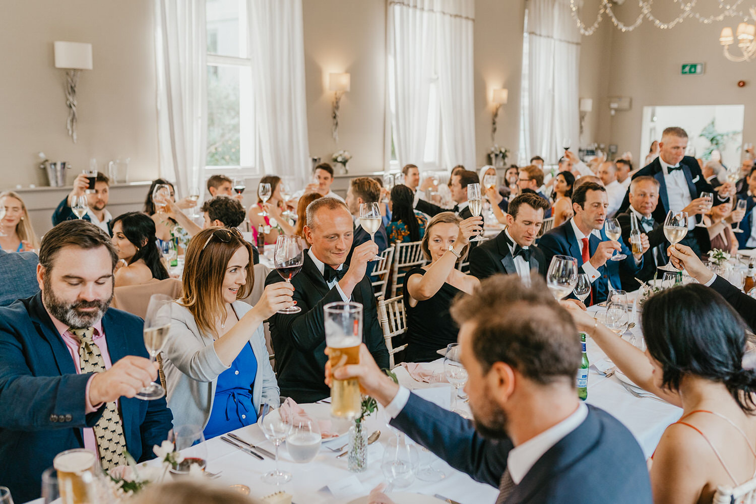 guests toast during wedding speeches at morden hall wedding