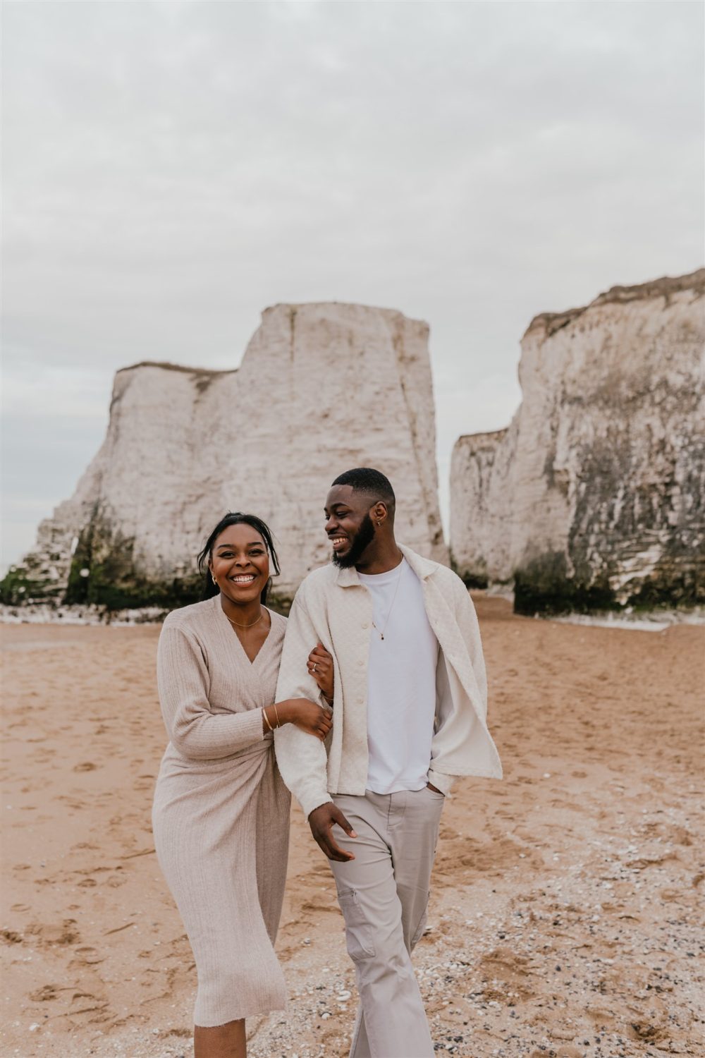 couple walking on the beach at botany bay in kent