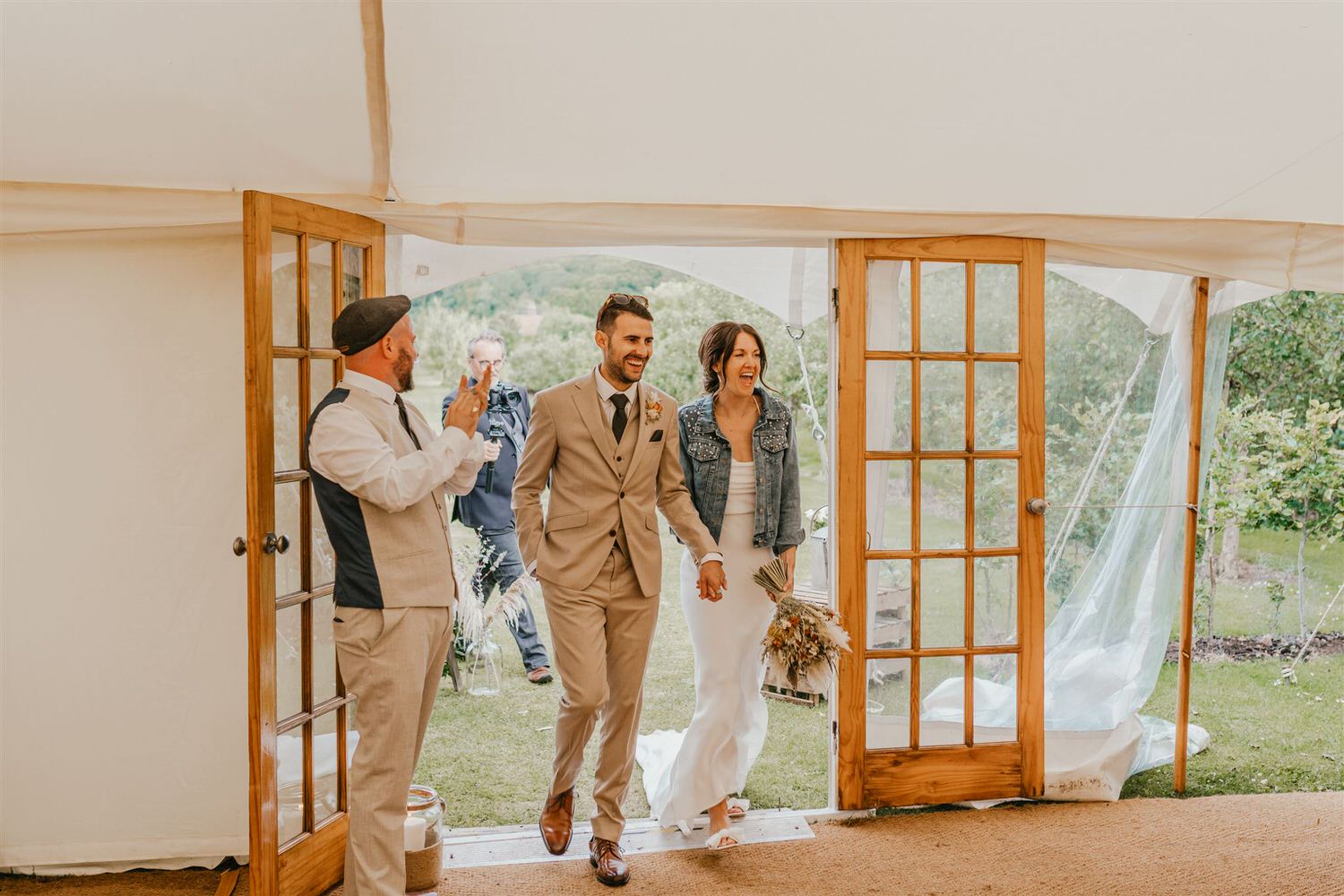 bride and groom entrance at kent wedding