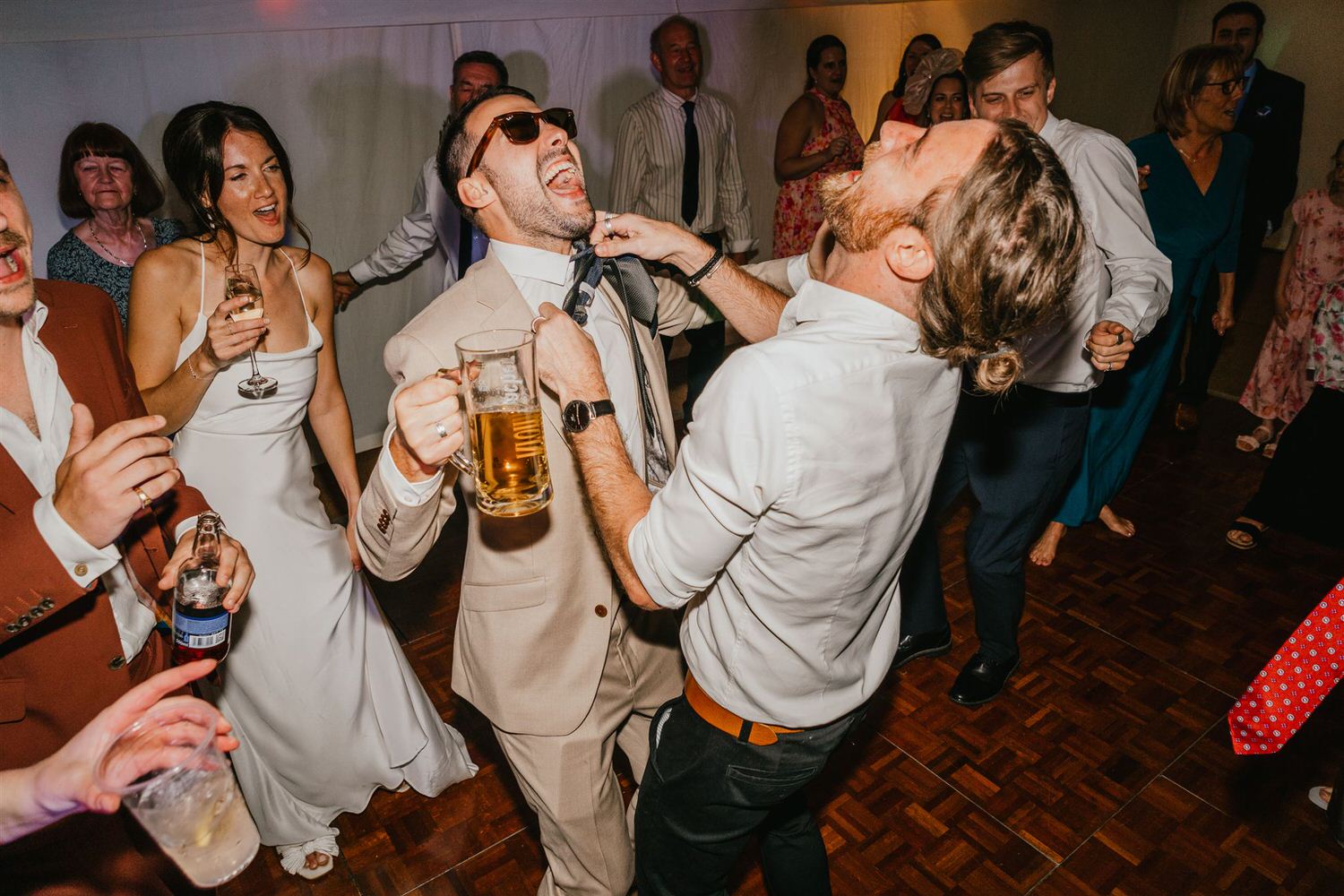 groom and wedding guests on the dancefloor