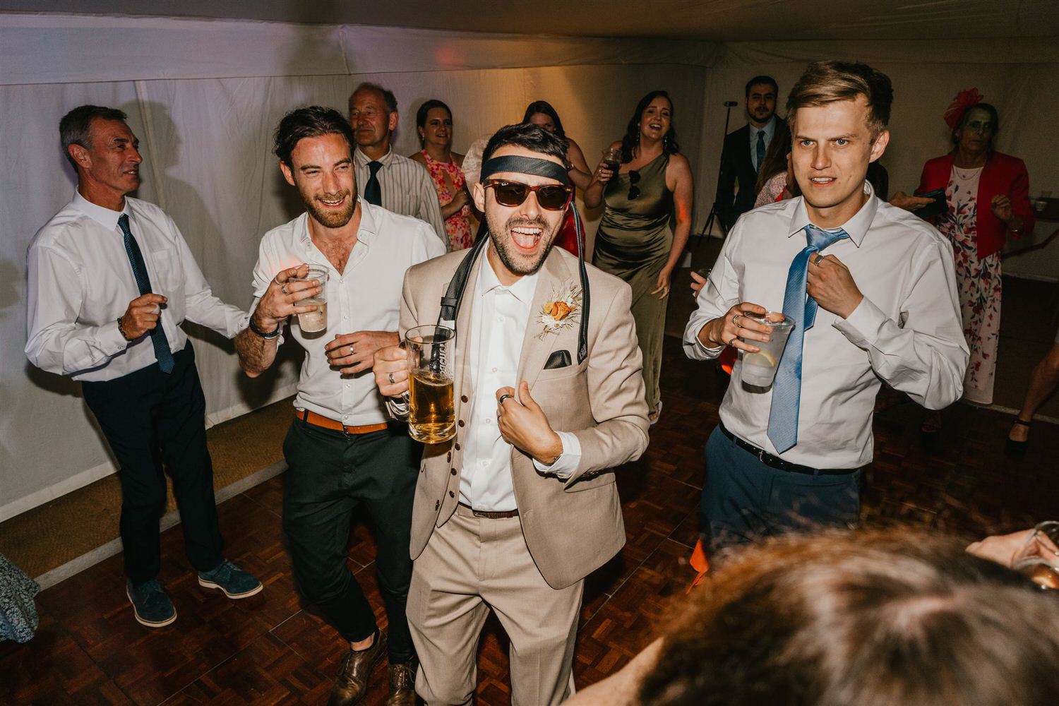 groom and wedding guests on the dancefloor
