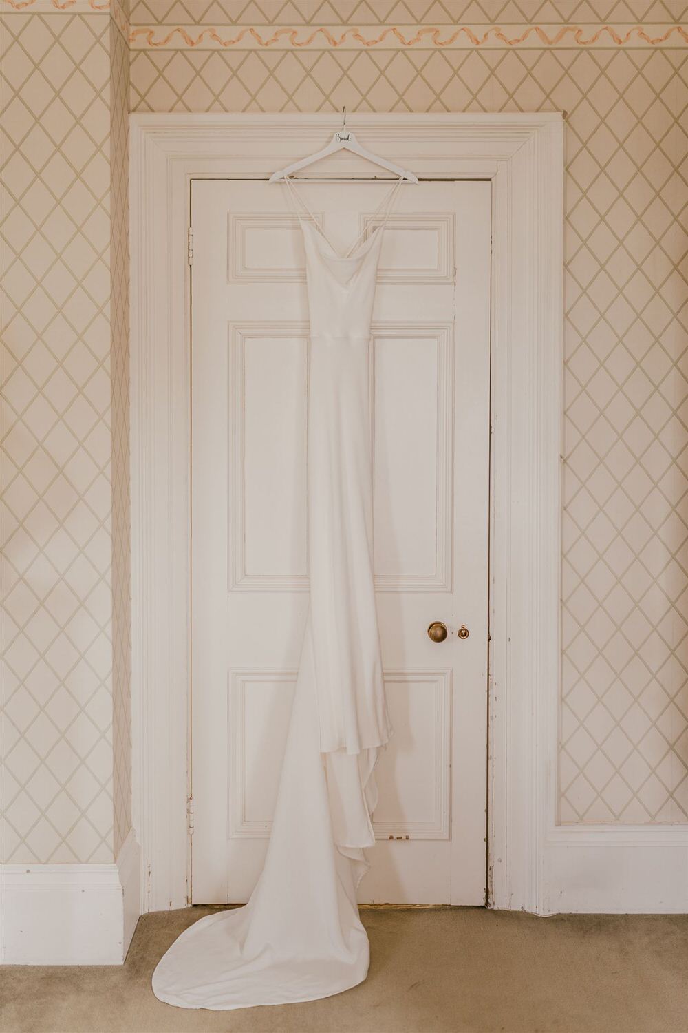 bride's dress hanging at mount ephraim wedding in kent