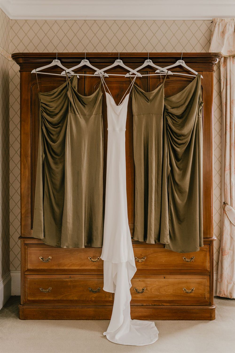 bride and bridesmaid dresses hanging at mount ephraim wedding in kent