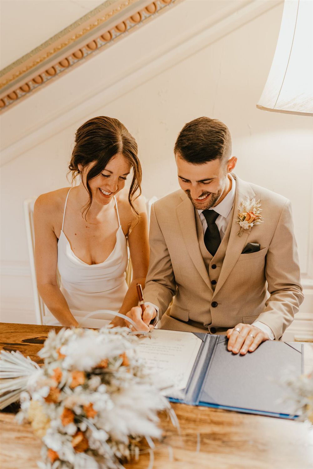 bride and groom sign certificate at mount ephraim wedding in kent
