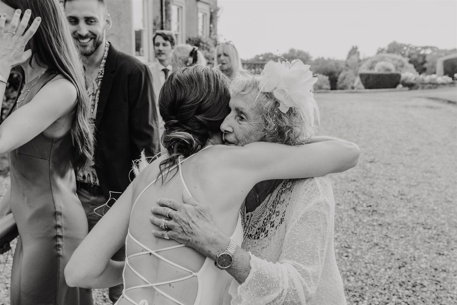 black and white photo of bride hugging her grandma at kent wedding