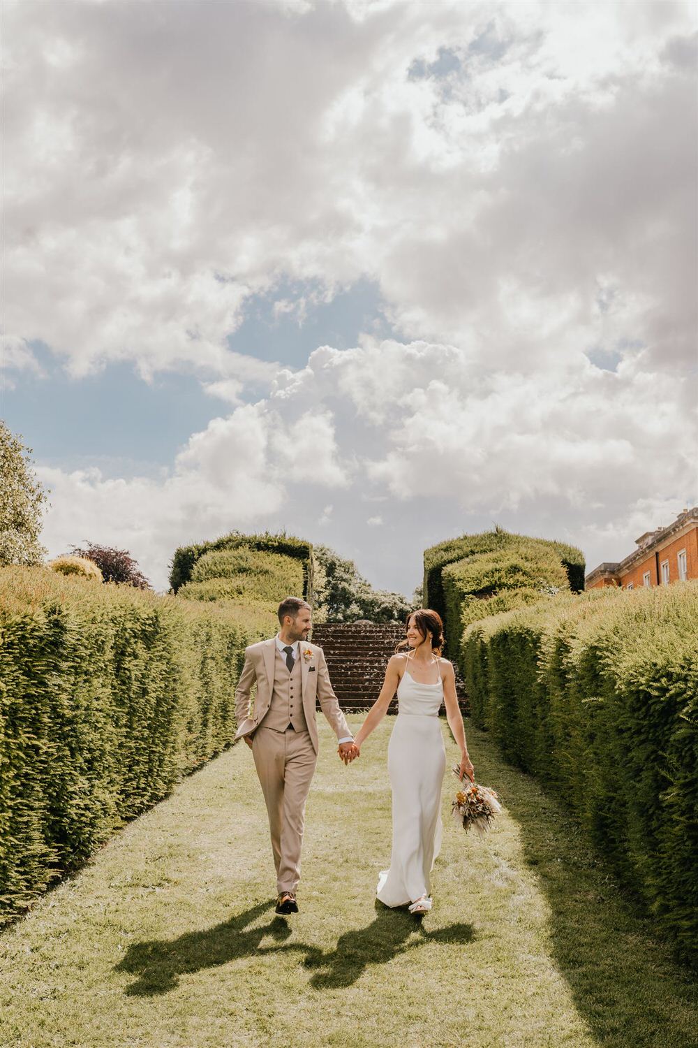 couple portraits in the gardens at mount ephraim wedding venue in kent