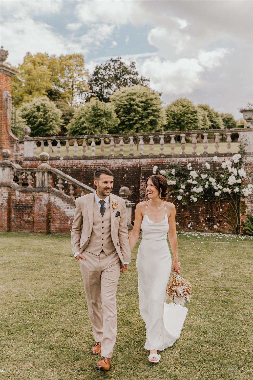 couple portraits in the gardens at mount ephraim wedding venue in kent