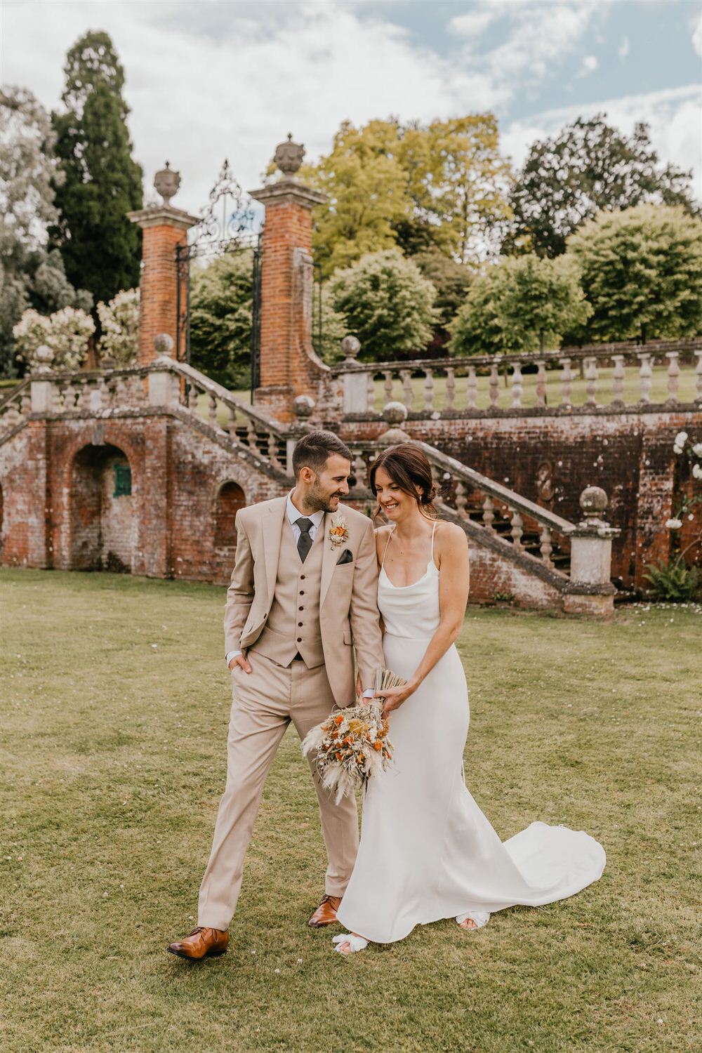 couple portraits in the gardens at mount ephraim wedding venue in kent