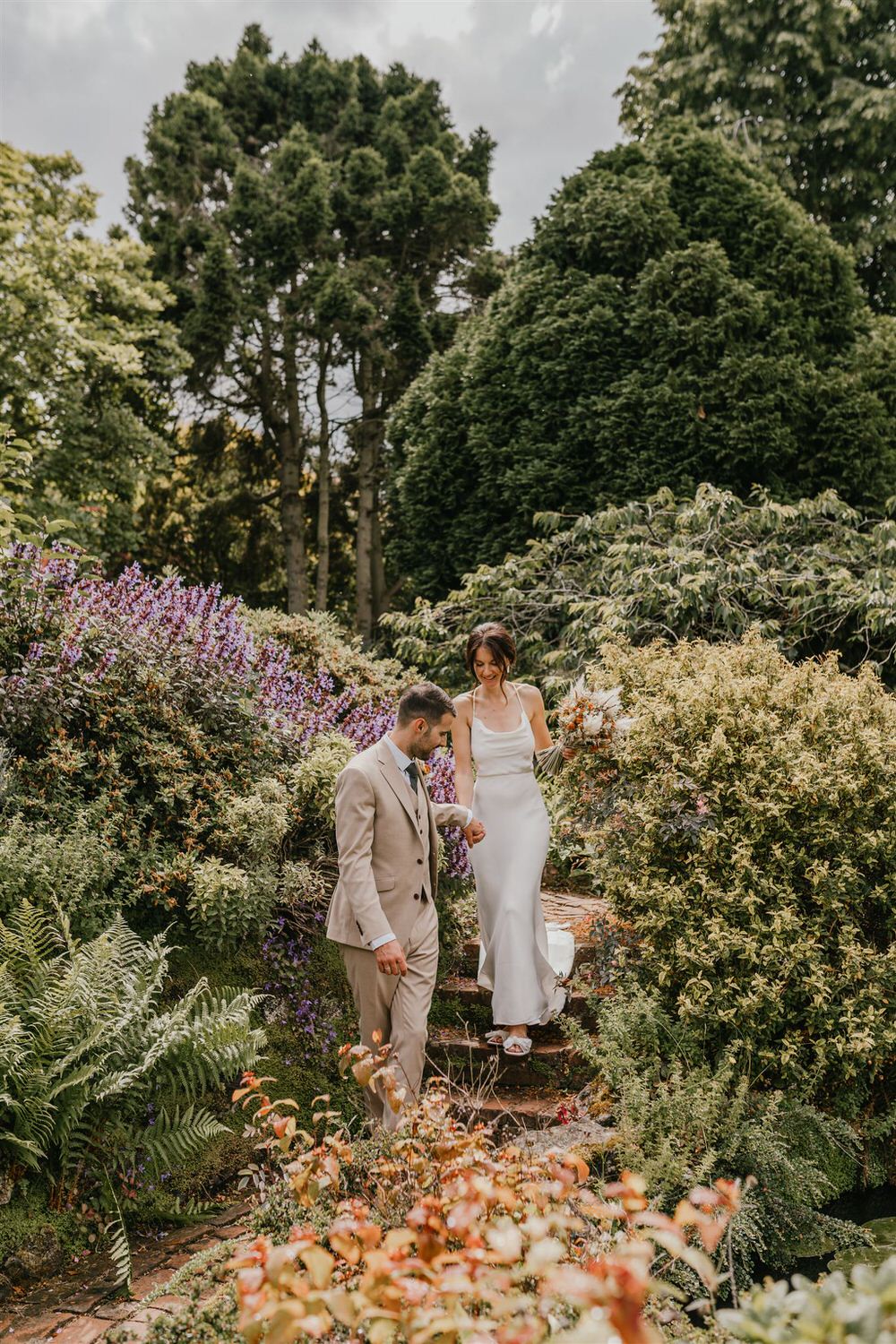 couple portraits in the gardens at mount ephraim wedding venue in kent