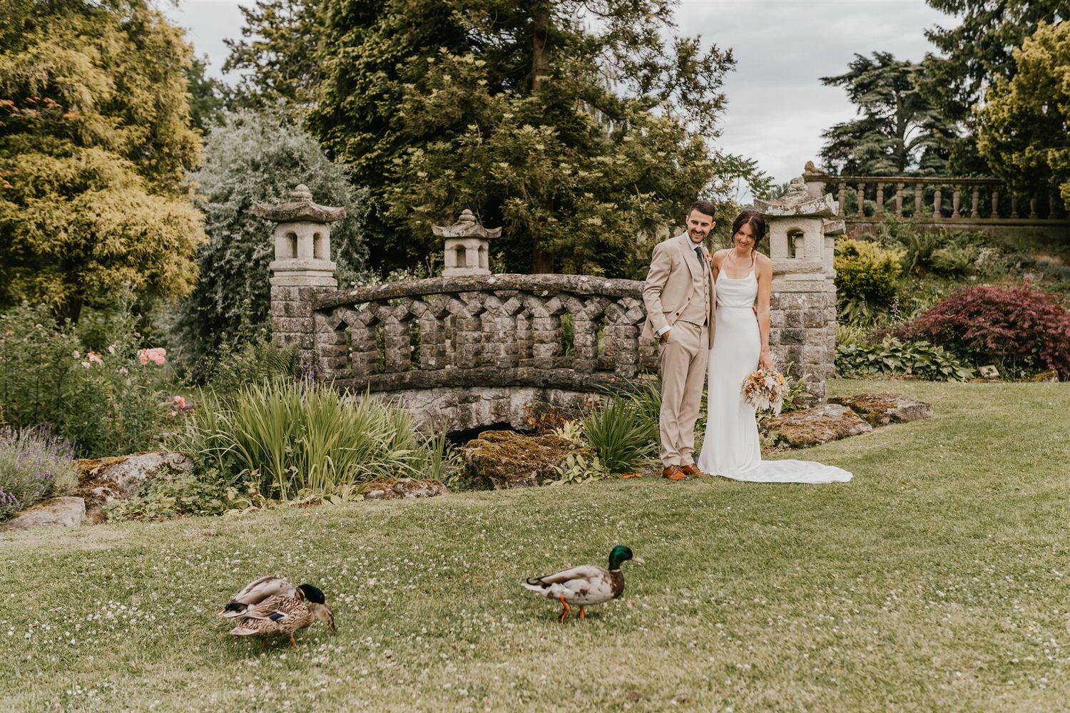 couple portraits in the gardens at mount ephraim wedding venue in kent