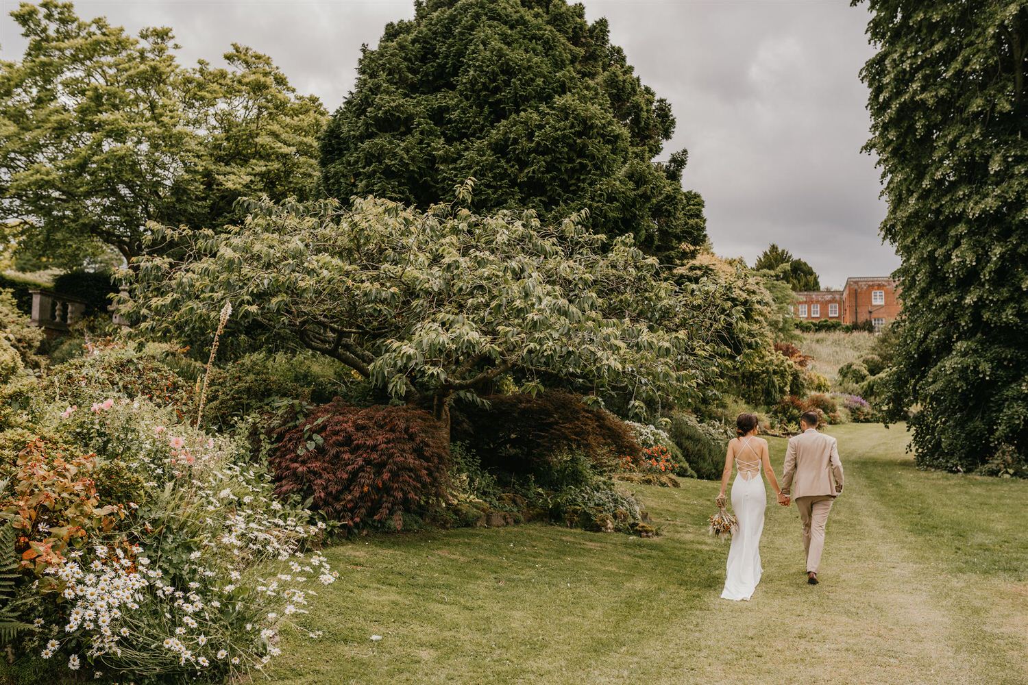couple portraits in the gardens at mount ephraim wedding venue in kent
