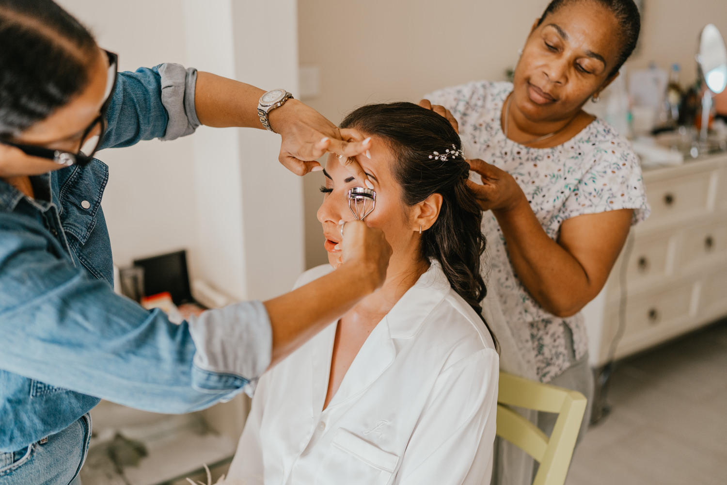 bride getting hair and makeup done at caribbean destination wedding