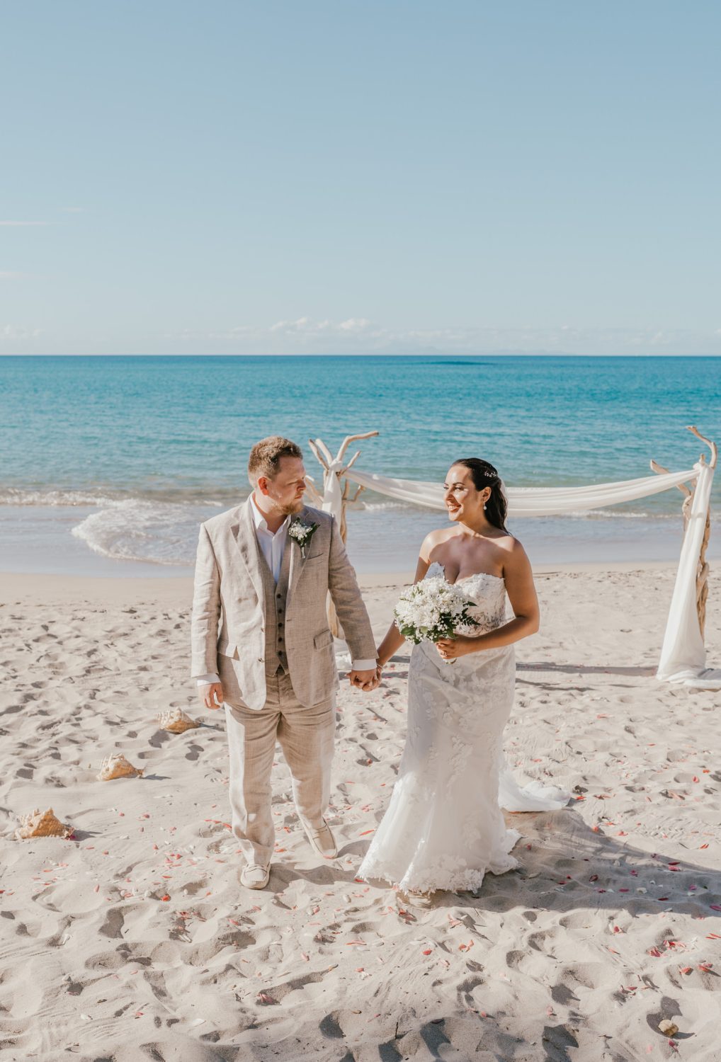 bride and groom on the beach during their saint lucia elopement at stolentime resort wedding venue