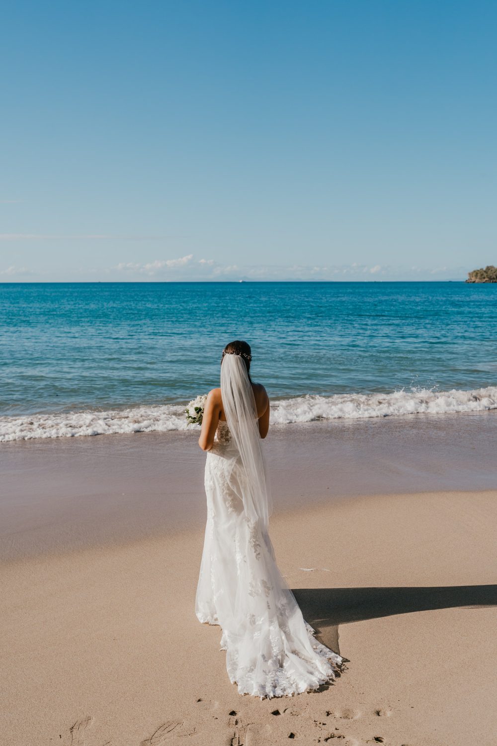 bride on the beach during their saint lucia elopement at stolentime resort wedding venue