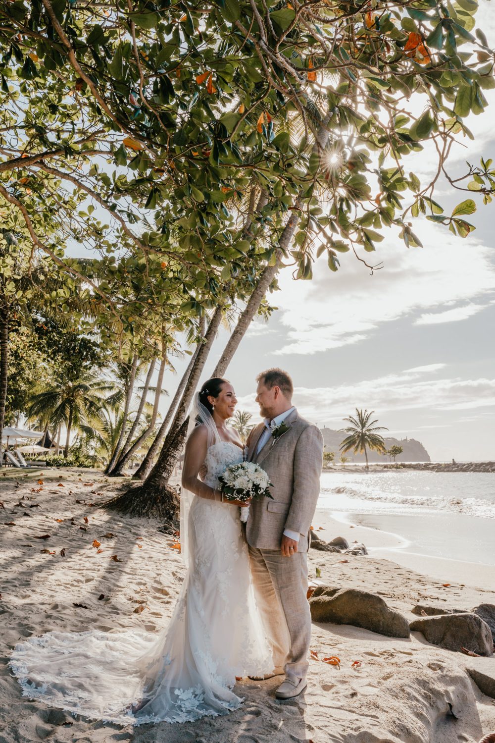 bride and groom on the beach during their saint lucia elopement at stolentime resort wedding venue