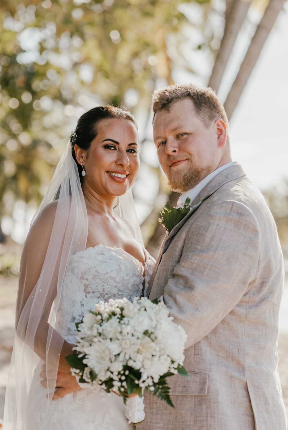bride and groom smile during their saint lucia elopement at stolentime resort wedding venue