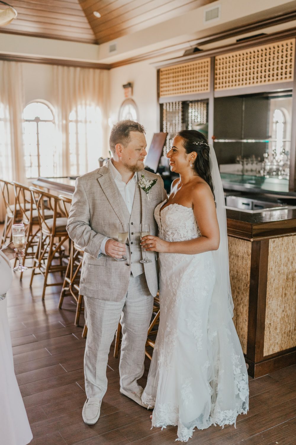 bride and groom in champagne bar at stolentime resort saint lucia wedding venue
